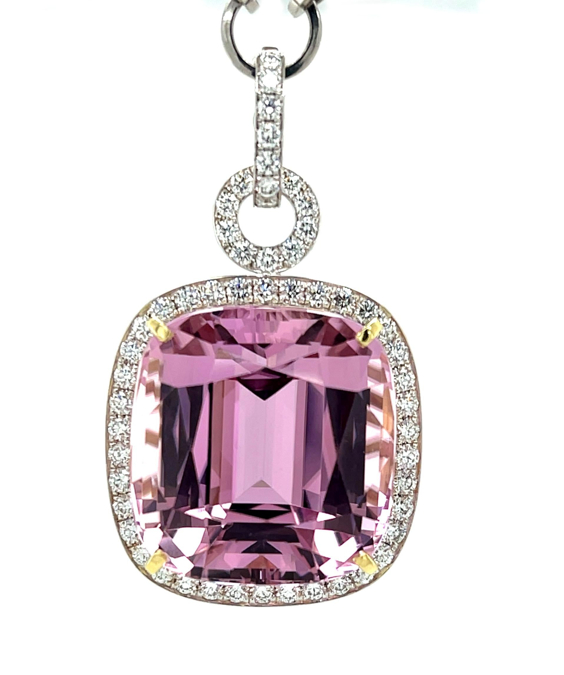 This beautiful statement necklace features a spectacular 61.26 carat kunzite cushion with stunning pink color! The gem is surrounded by fine diamonds in an original pendant that is breath-taking from every angle. The kunzite is beautifully
