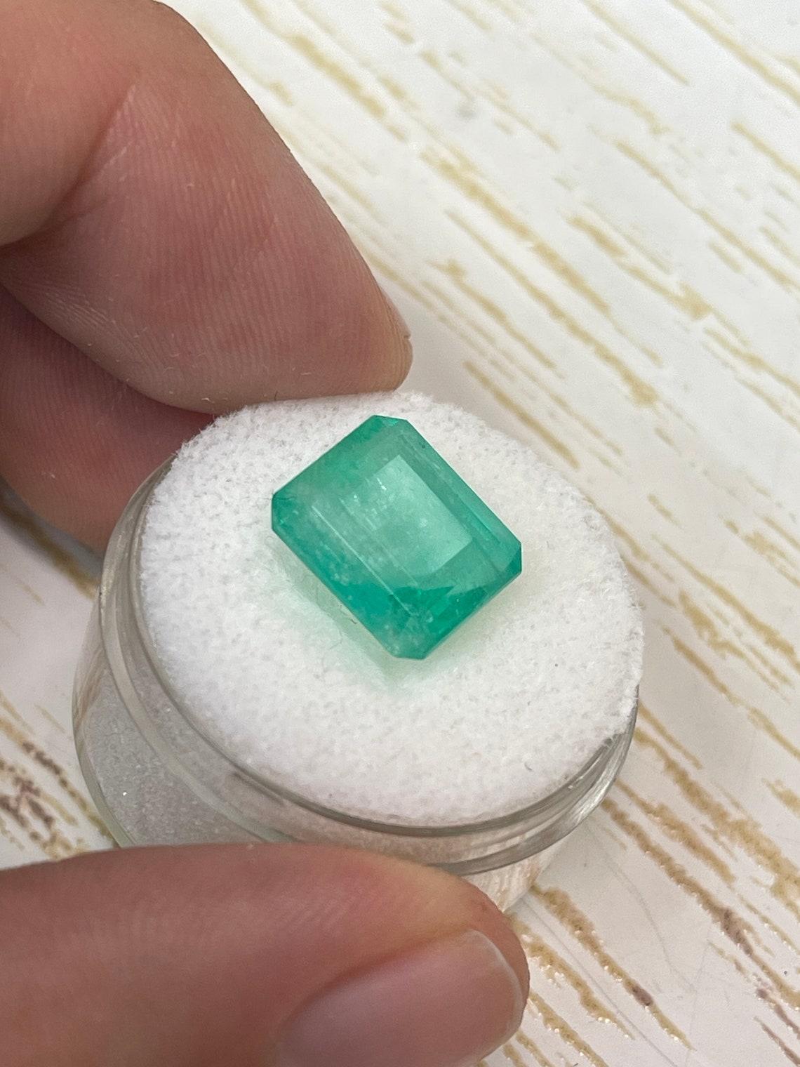 6.13 Carat 11.5x10.3 Earthy Pastel Green Colombian Emerald - Emerald Cut May In New Condition For Sale In Jupiter, FL