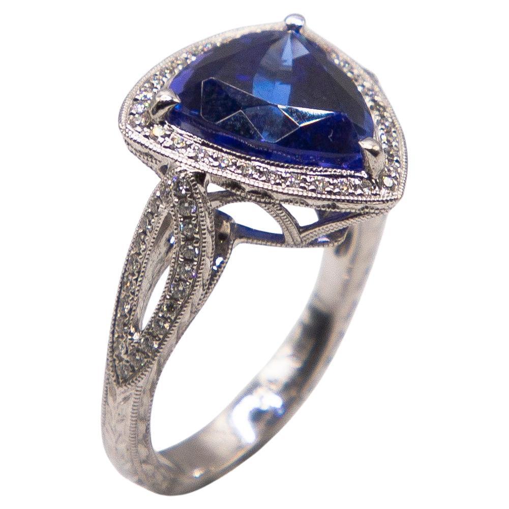 6.13 carat designer trillion-cut Tanzanite 18k gold diamond ring/ hand engraved For Sale