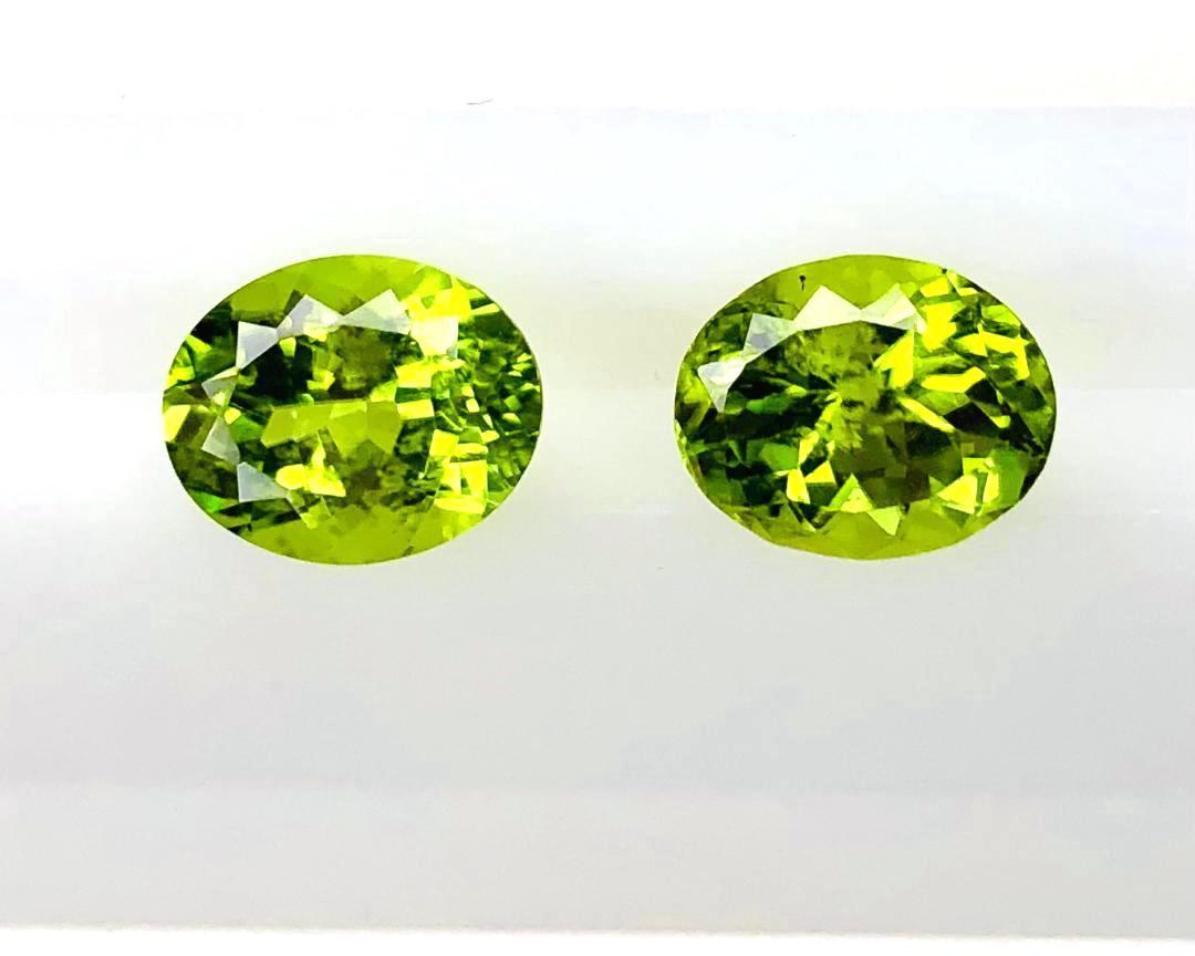 This pair of beautiful oval peridots is exceptionally brilliant and full of life! Measuring 10.00 x 8.00 millimeters, they are calibrated in size, meaning they can be set in 