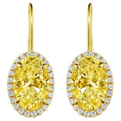 6.13ct GIA Certified Oval Yellow Diamond Earrings in 18KT Gold