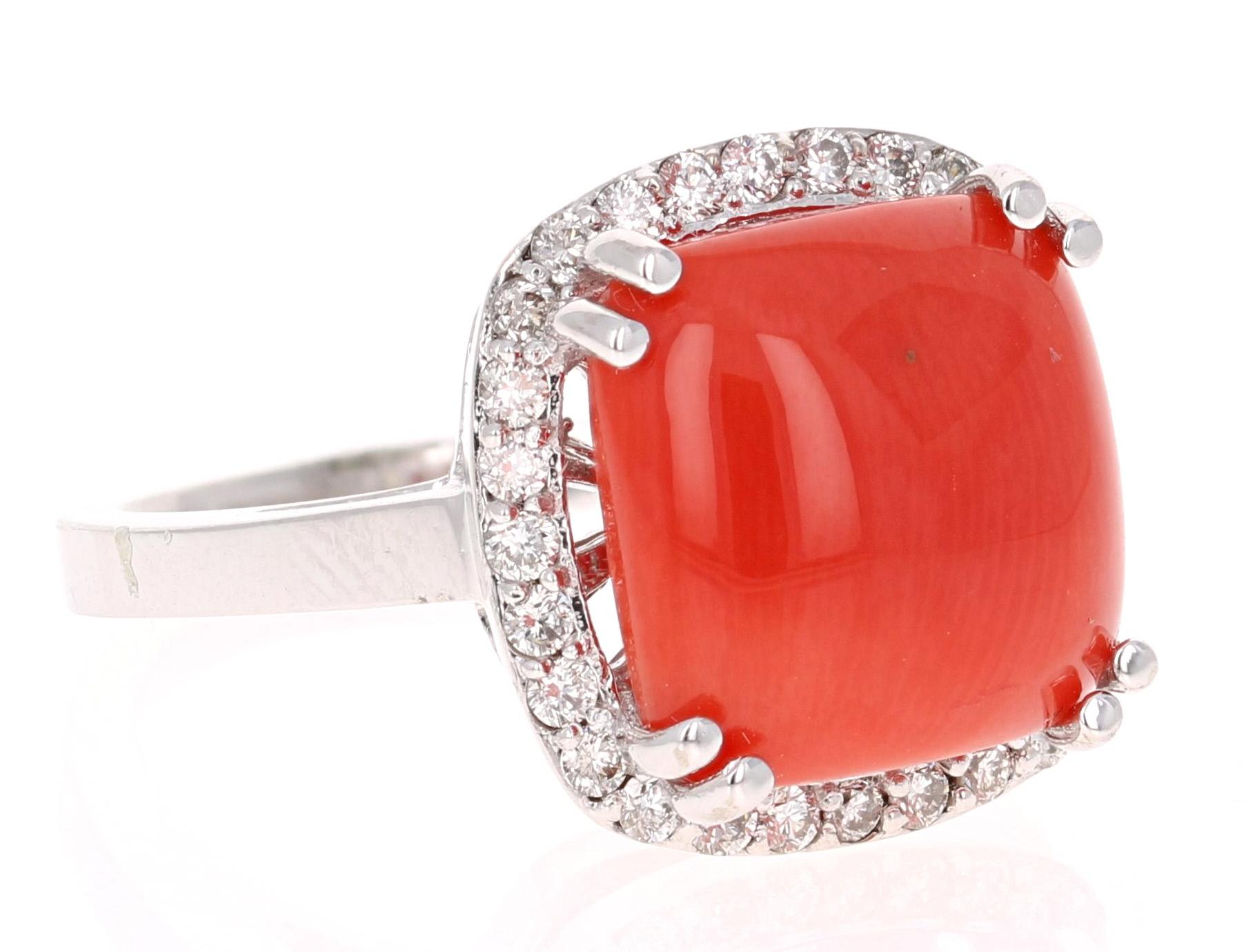 This Natural Coral weighs 5.66 Carats and is adorned by 28 Round Cut White Diamonds weighing 0.48 Carats, with a clarity and color of VS2-H. The Total Carat Weight of this beauty is 6.14 Carats. 
It is crafted in 14K White Gold and weighs 7.0 grams.