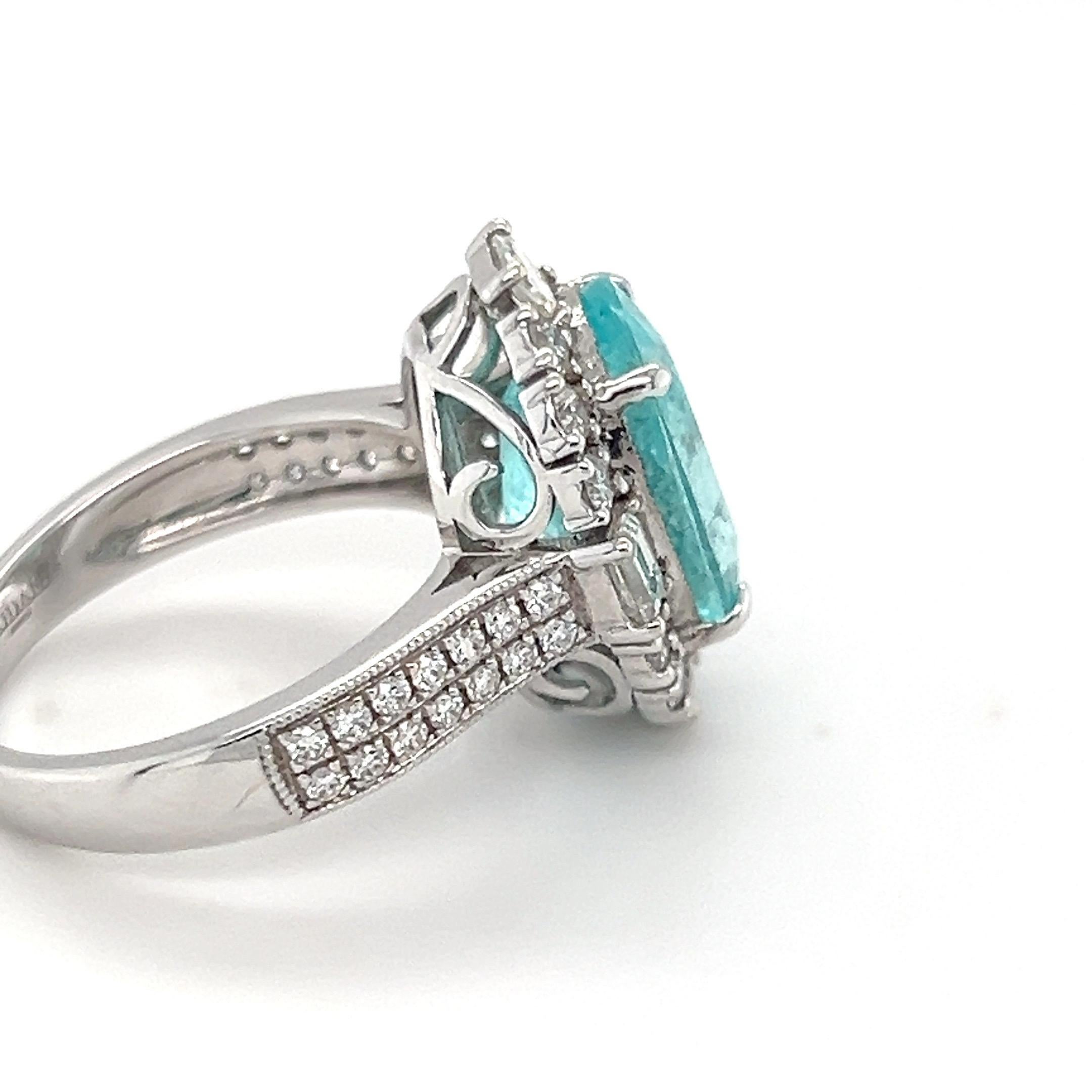 Artisan 6.14 Carat Oval Cut Paraiba Tourmaline Diamond Engagement Ring For Sale
