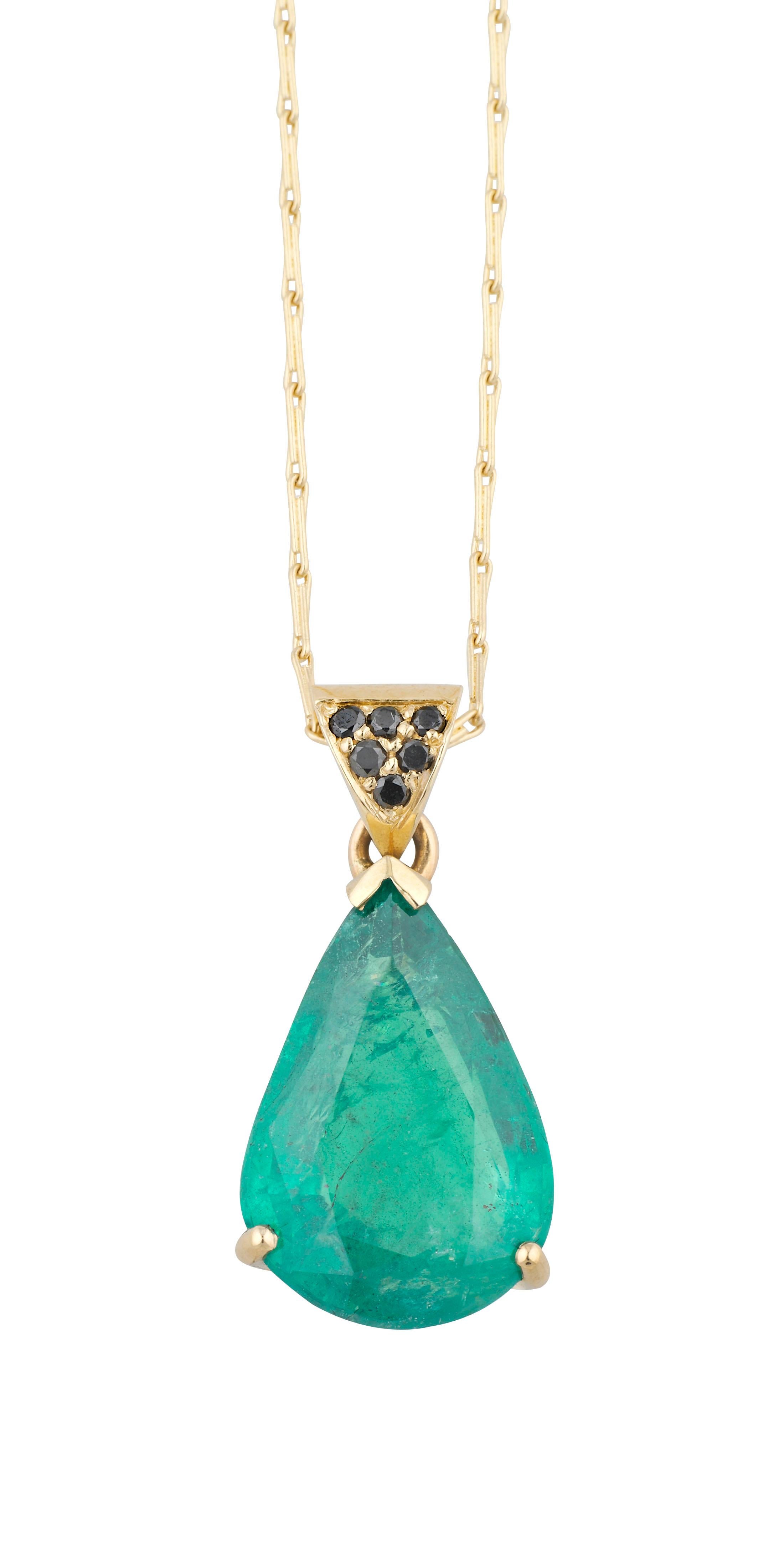 This simple modern handmade British-London Hallmarked 18 karat yellow gold pendant with long chain necklace, set with 6.15 carat pear shaped emerald and black diamond is from MAIKO NAGAYAMA's Haute Couture Collection called 