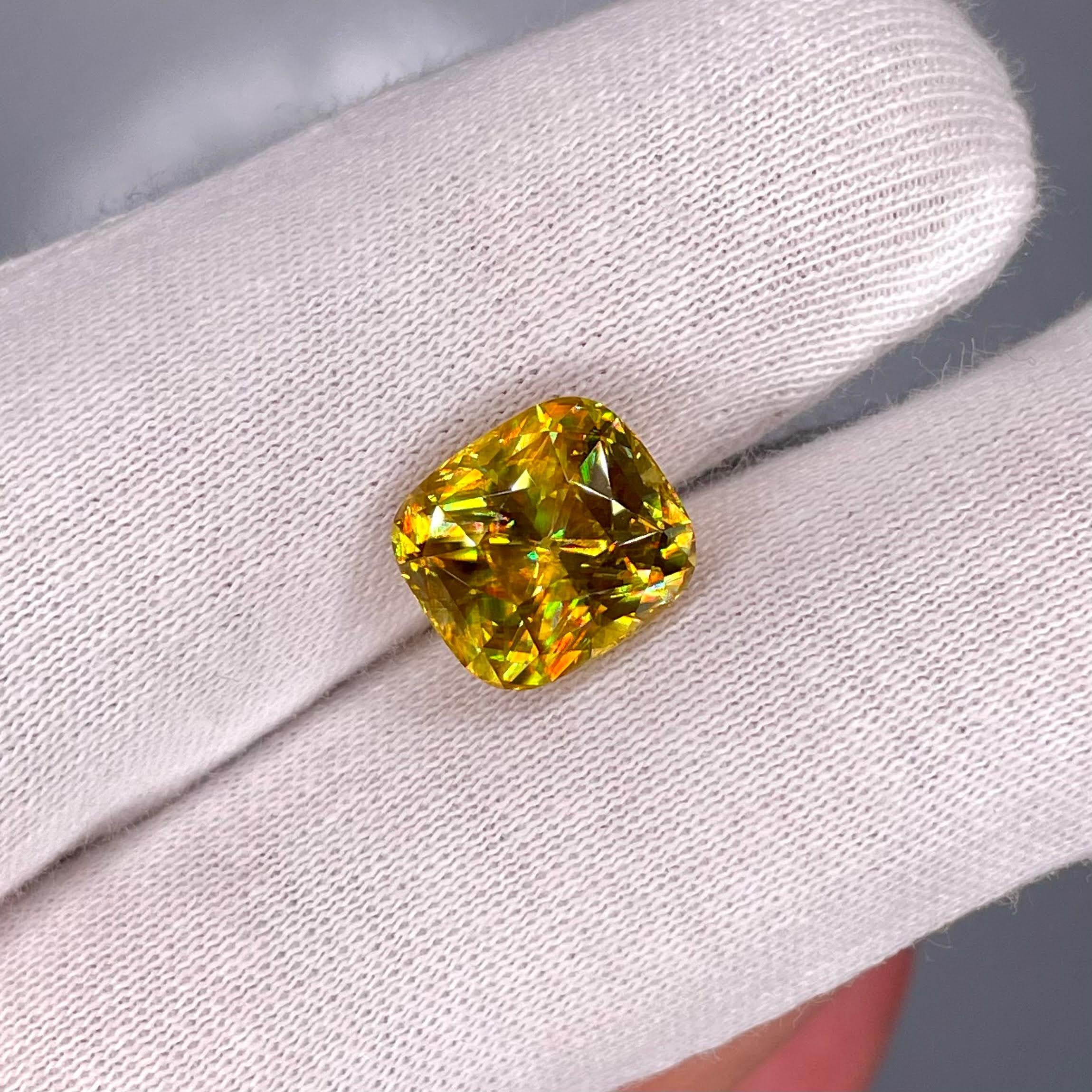 Weight 6.15 carats 
Dimensions 10.73x9.71x7.45 mm
Treatment none 
Origin Madagascar 
Clarity VVs
Shape cushion 
Cut fancy cushion 



The 6.15 carats Fine Quality Sphene Stone, with its mesmerizing Fancy Cushion Cut, stands as a radiant testament to