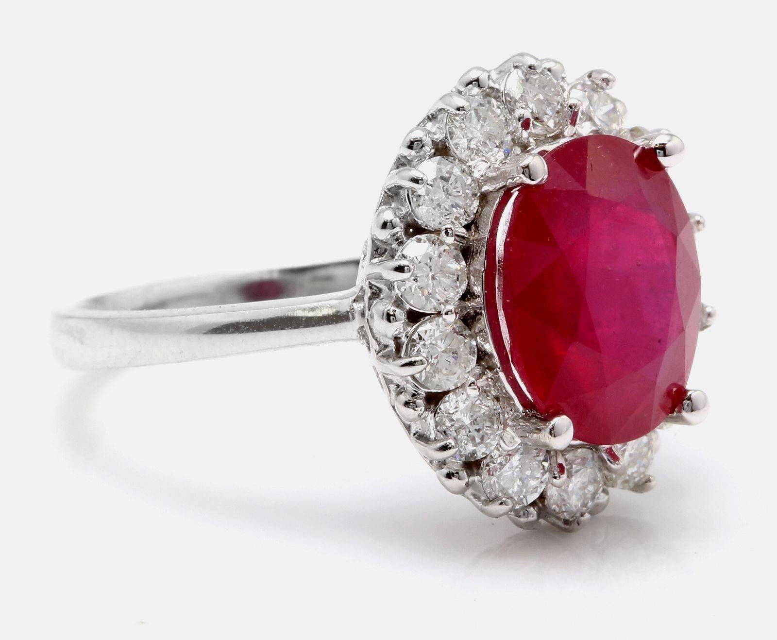 6.15 Carats Impressive Natural Red Ruby and Diamond 14K White Gold Ring

Total Red Ruby Weight is: Approx. 5.15 Carats

Ruby Treatment: Lead Glass Filling

Ruby Measures: Approx. 11.00 x 9.00mm

Natural Round Diamonds Weight: Approx. 1.00 Carat