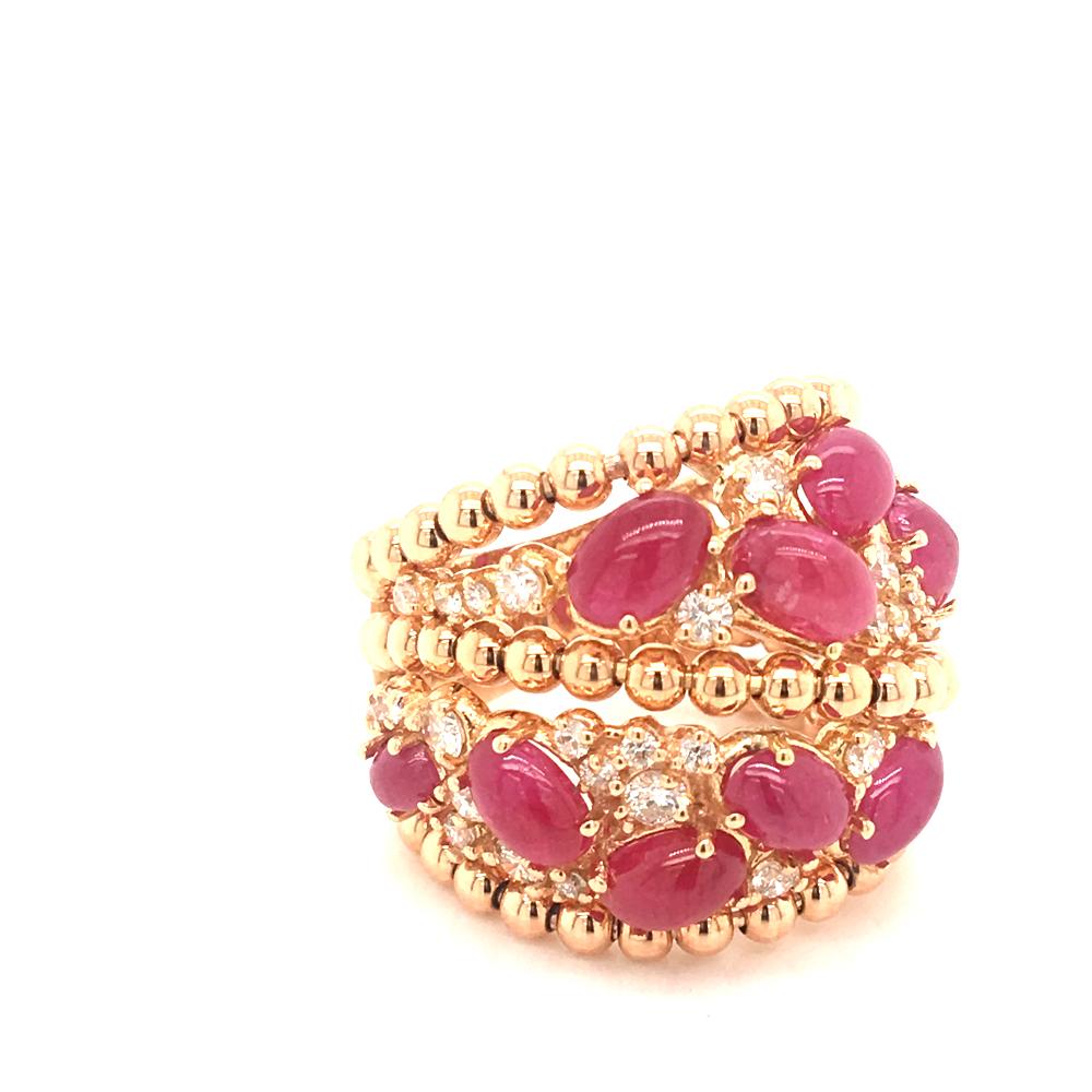 18 KT rose gold Cocktail ring
set with 10 oval shape cabochon  ruby 
and 0.85 carats round diamonds color G  clarity VS
the gold is worked as a torshon motif
Made in Italy  comes in a Box
finger size 12 Italian size
