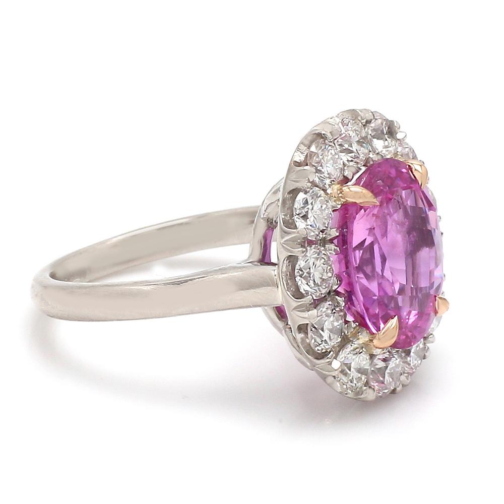 6.15ct ceylon no heat pink sapphire
This sapphire is a gorgeous bubble gum pink color 
AGL certified
The ring consists of 1.92ctw of round cut diamonds