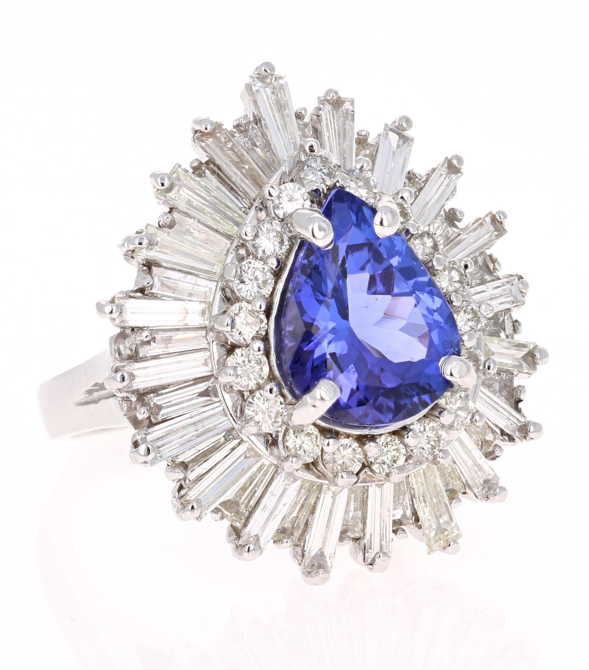 Elegant Victorian-Inspired Ballerina Setting Ring! 

This ring has a radiant bluish-purple Pear Cut Tanzanite weighing 3.17 Carats. It is surrounded by 18 Round Cut Diamonds that weigh 0.54 Carats and 41 Baguette Cut Diamonds that weigh 2.45 Carats.