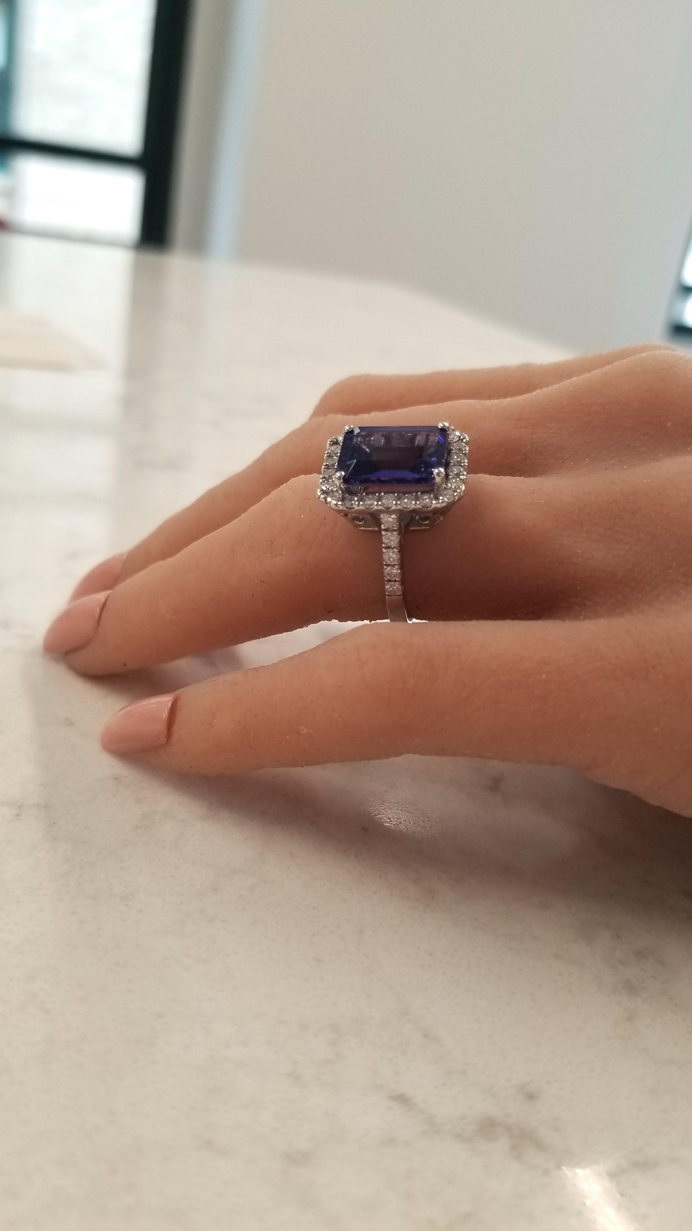 This is an emerald cut tanzanite with a weight of 6.12 carats with measurements of 12.82x9.50mm. The gem source is near the foothills of Mt. Kilimanjaro in Tanzania. Its color is a deep bluish-purple; its transparency, luster, and cutting are
