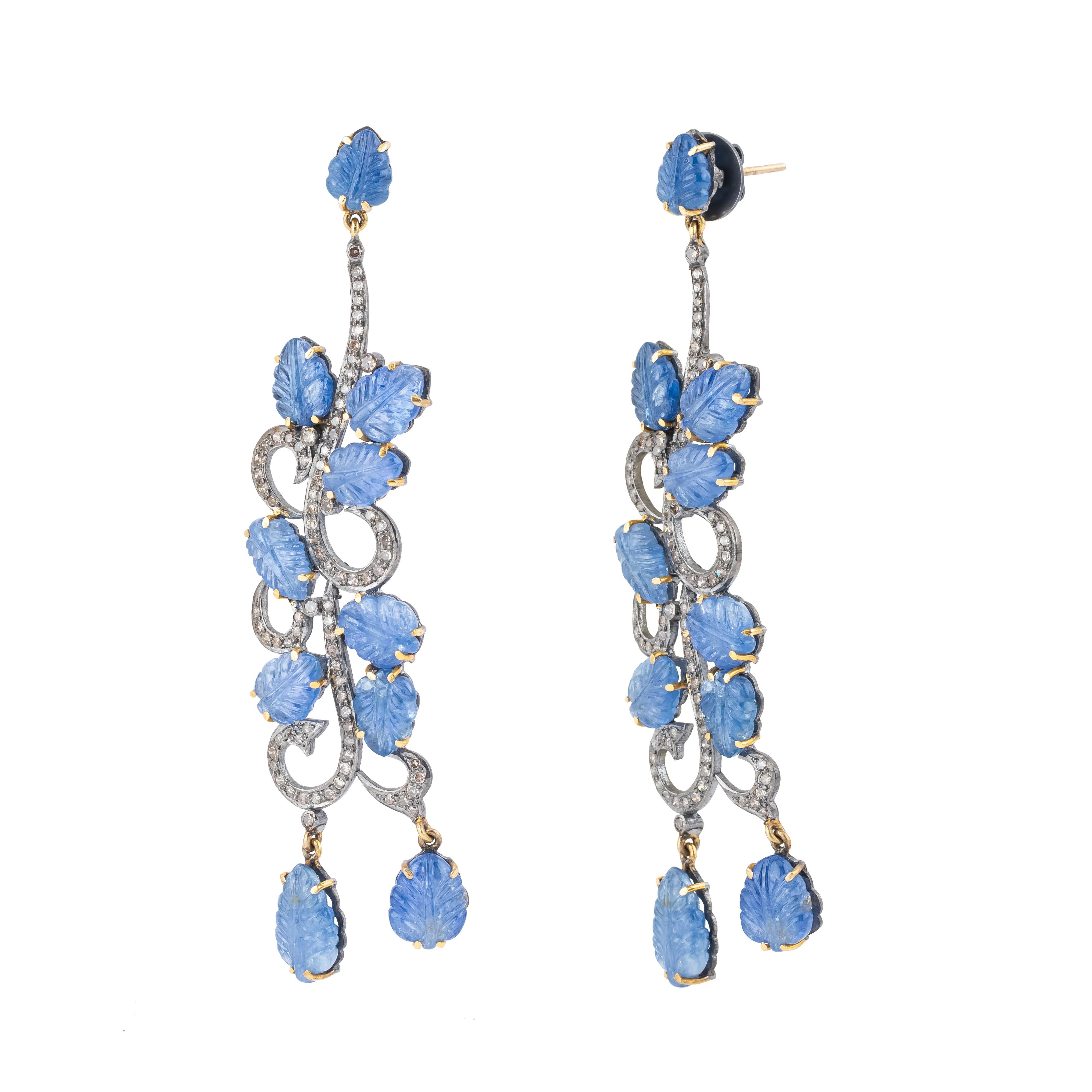 A breathtaking fusion of brilliance and deep allure, the 61.8 Carat Diamond and Sapphire Dangle Earrings embody luxurious craftsmanship and timeless design. Featuring a dramatic arrangement of diamonds and sapphires, these earrings are curated to