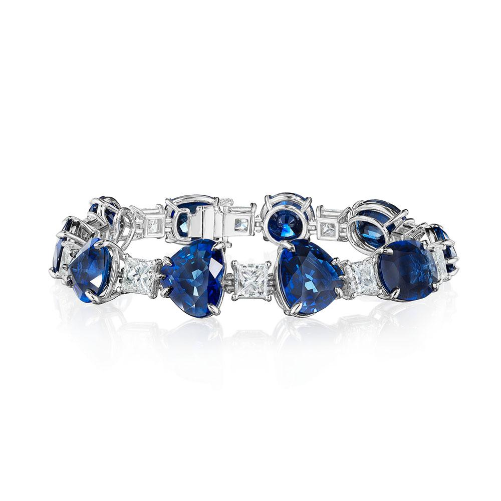 •	18KT White Gold
•	61.85 Carats
•	7” Long

•	Number of Sapphires: 10
•	Carat Weight: 53.34ctw
•	All Sapphires are Certified by GRS or Bellerophon

•	Number of Princess Cut Diamonds: 10
•	Carat Weight: 8.51ctw
•	Color: H, I, J
•	Clarity: VVS2 –