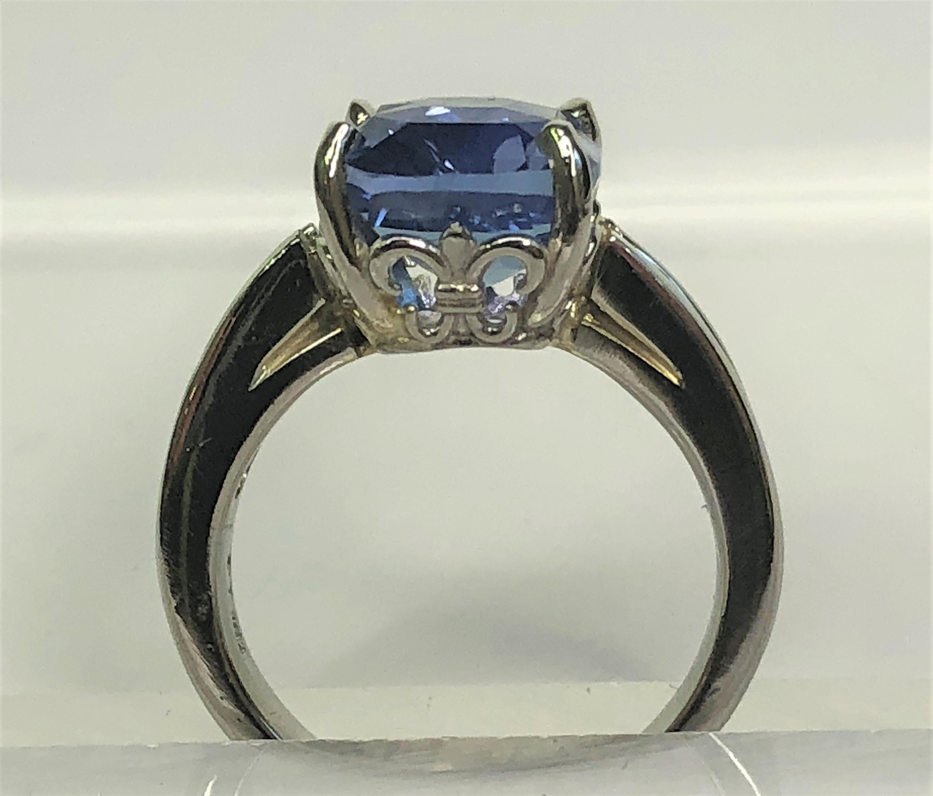 This GIA certified natural, no heat sapphire is a must have!
Modified Brilliant step cut sapphire is 10.64 x 9.03 x 6.10mm, 6.18 total carat weight.
5 graduating square cut diamonds on each shoulder, ranging from approximately .12tdw - .06tdw
Per
