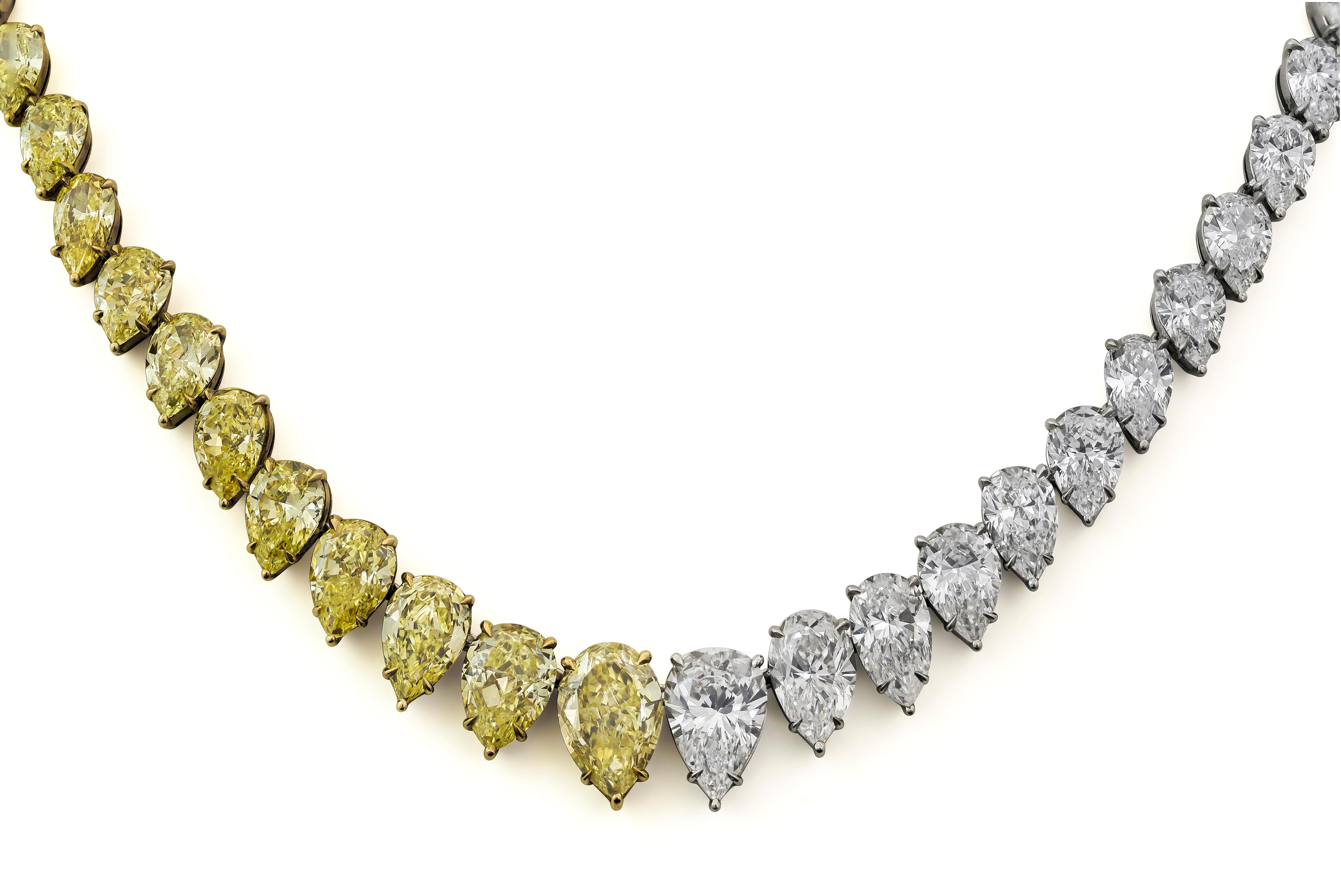 A well-crafted necklace, showcasing 28 pear shape yellow diamonds weighing 32.31 carats total and 28 pear shape diamonds weighing 29.65 carats total. Yellow diamonds are set on a five prong 18K yellow gold setting. White diamonds are set on a five