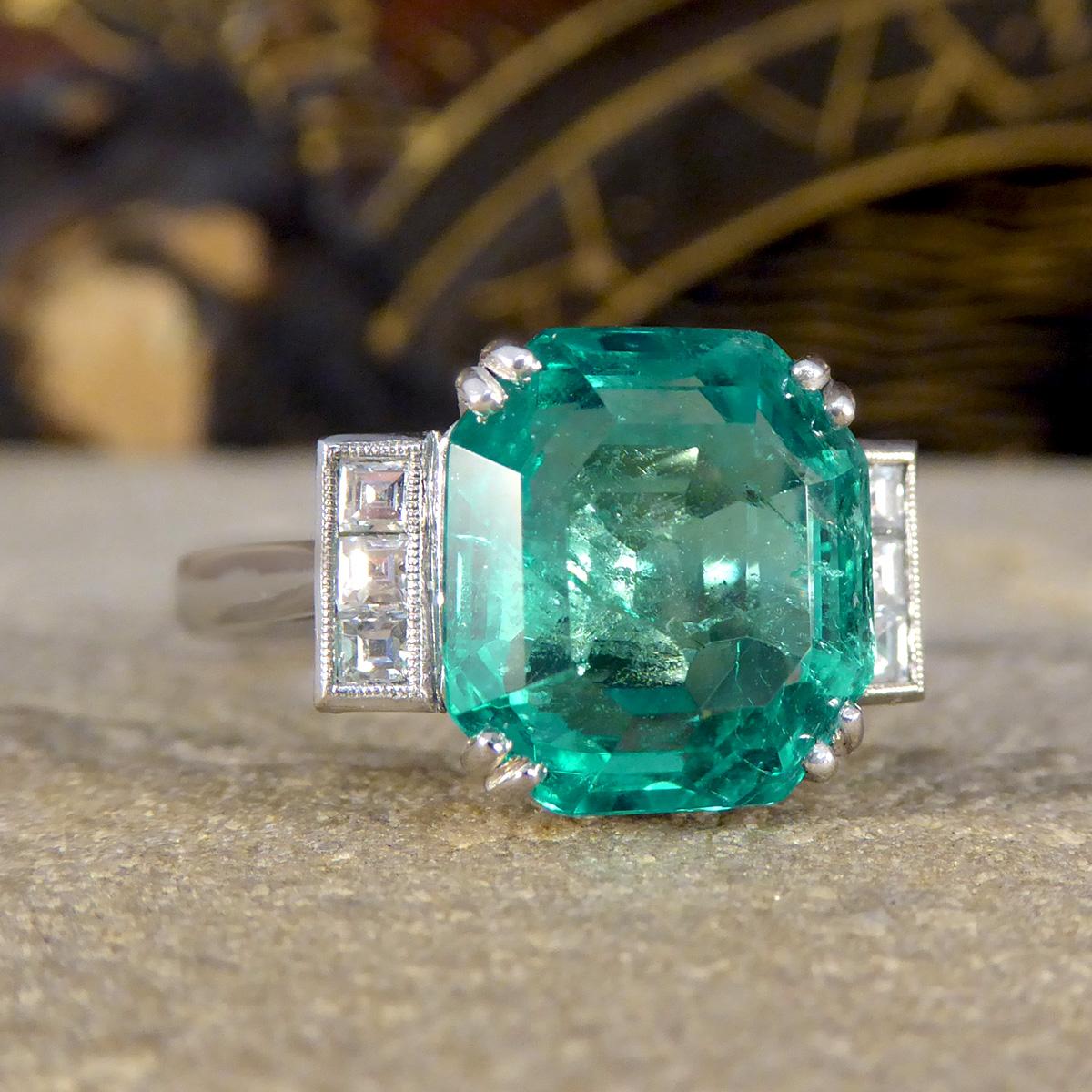 Introducing our exquisite 6.19ct Octagonal Cut Colombian Emerald Ring, a masterpiece of refined elegance and timeless design. At the heart of this luxurious piece is a magnificent, bright, and vibrant Colombian emerald, showcasing an impressive 6.19