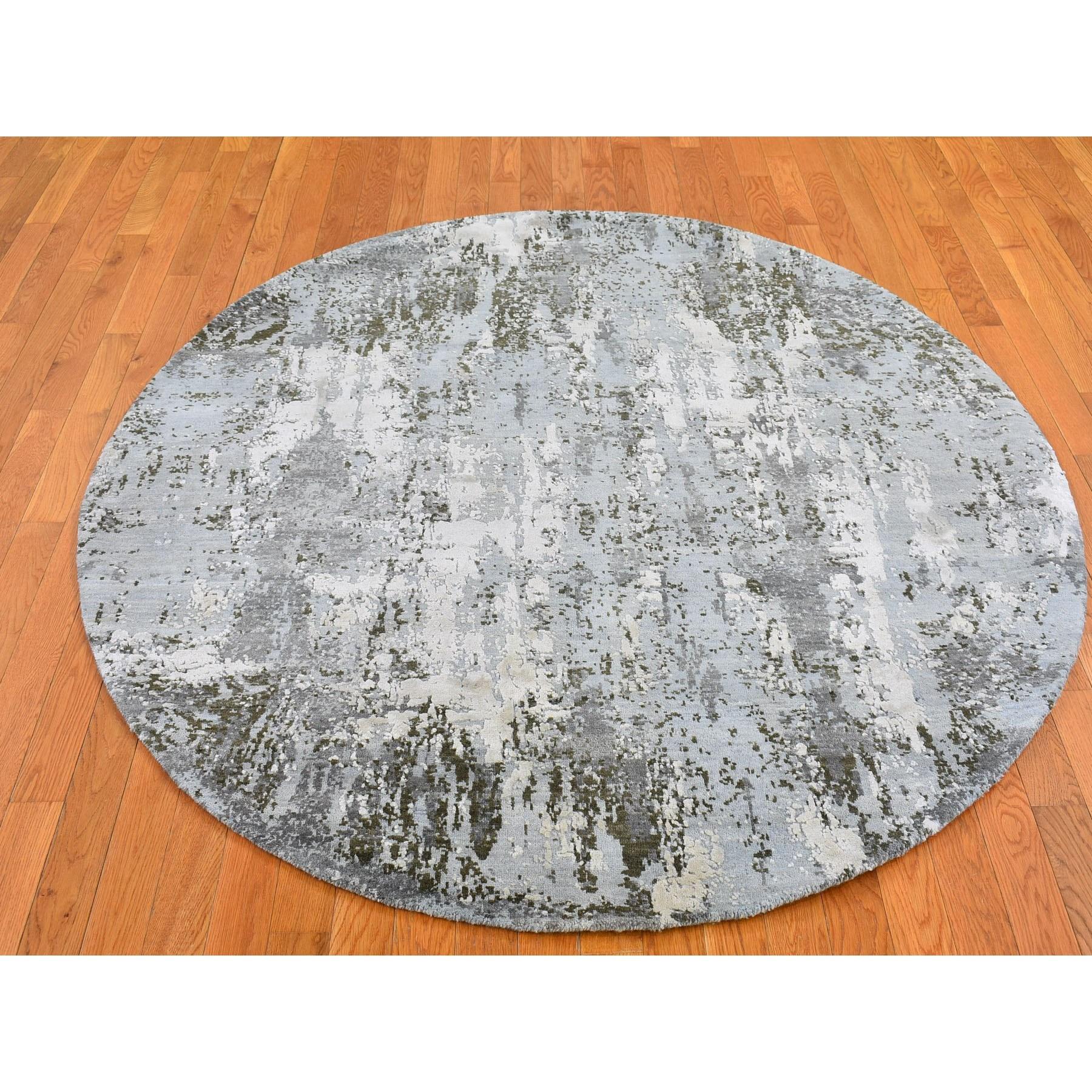 This is a truly genuine one-of-a-kind Denser Weave Baby Blue Round Abstract Design Persian Knot Wool and Silk Hand Knotted Oriental Rug. It has been woven for months and months in the centuries-old Persian weaving craftsmanship techniques by expert