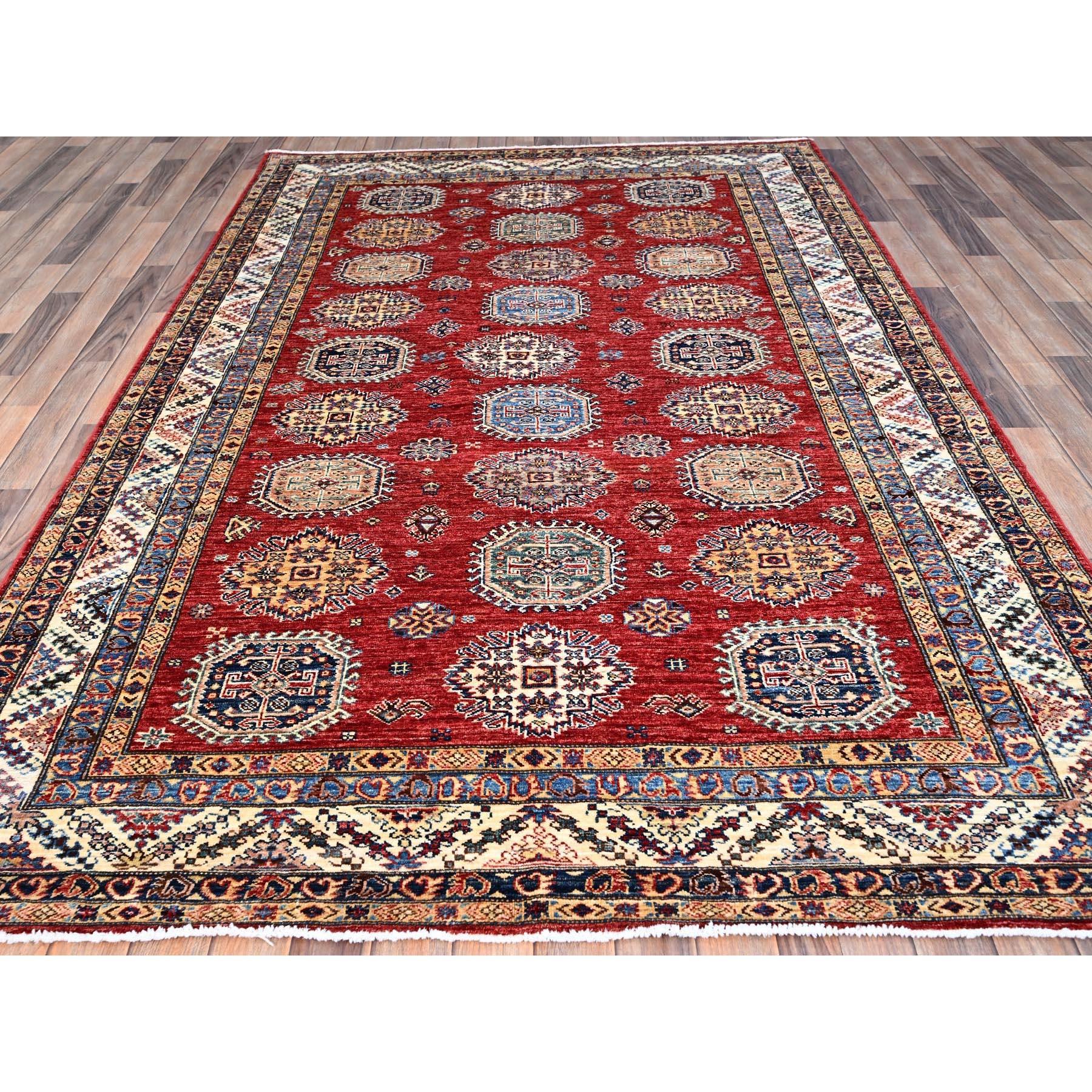 This is a truly genuine one-of-a-kind Afghan Super Kazak, Hand Knotted, Pure Wool, Oriental Rug. It has been Knotted for months and months in the centuries-old weaving craftsmanship techniques by expert artisans.
Primary materials: Wool
Latex: No