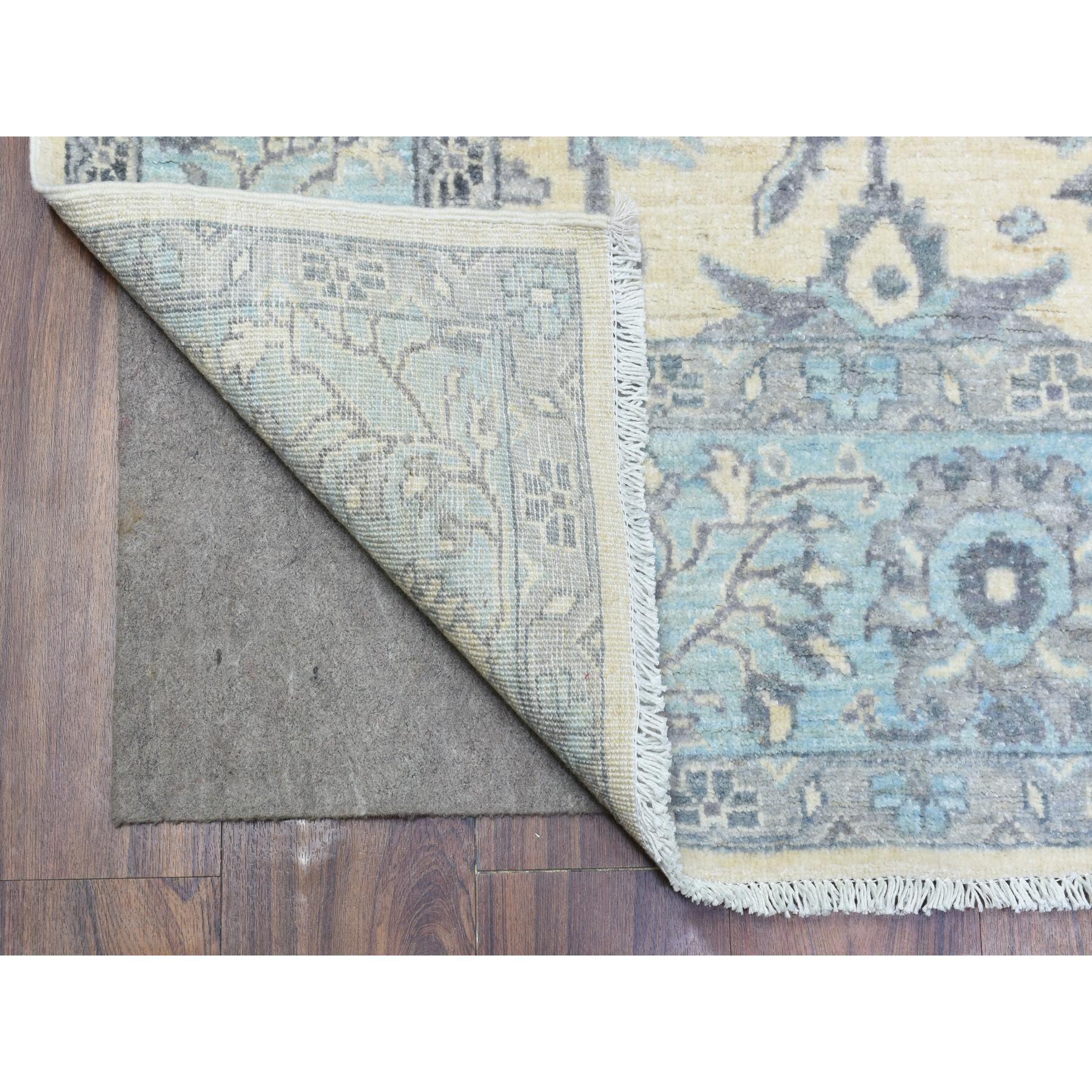 This is a truly genuine one-of-a-kind Ivory, Hand Knotted Fine Peshawar with Heriz Design, Natural Dyes Densely Woven, Soft Organic Wool, Oriental Rug. It has been Knotted for months and months in the centuries-old weaving craftsmanship