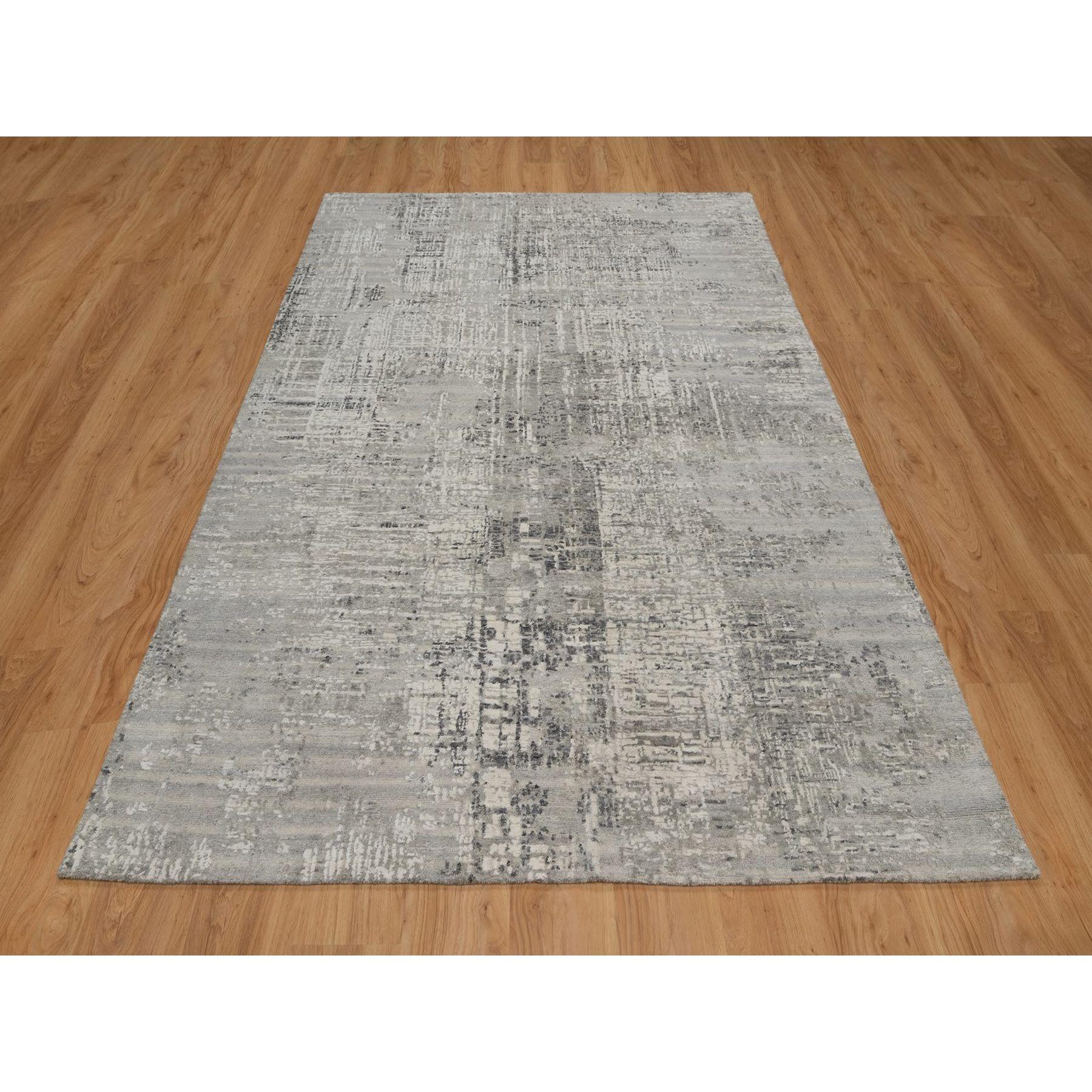 Pastel Gray, Modern Erased Design, Hand Spun Undyed Natural Wool, Hand Knotted, Oriental Rug
Primary materials: Wool
Latex: No Pile 
height: 0.25 Inches
Style: Contemporary
Primary color: Grey
Secondary colors: Silver, Ivory, Black
Pattern: Oriental