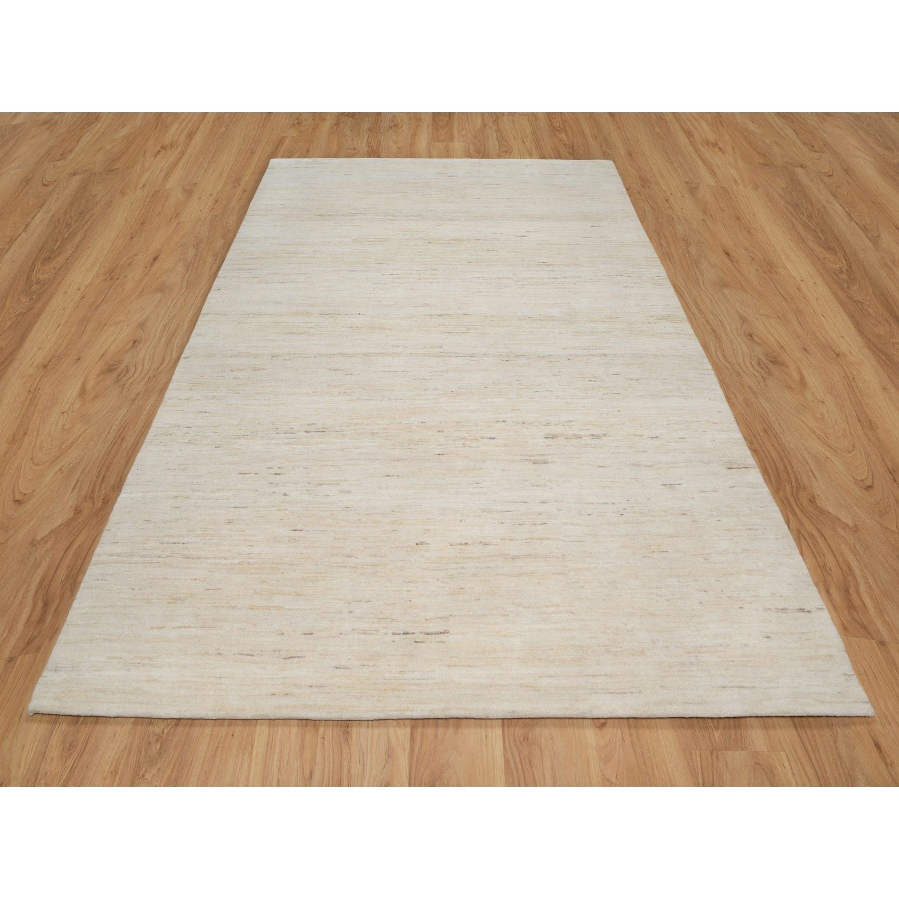 Stone White, Hand Knotted, Lori Buft Gabbeh, Modern Plain Design, Soft To The Touch, Thick and Plush, 100% Wool, Oriental Rug
Primary materials: Wool
Latex: No Pile 
height: 0.25 Inches
Style: Transitional
Primary color: Ivory
Secondary colors: