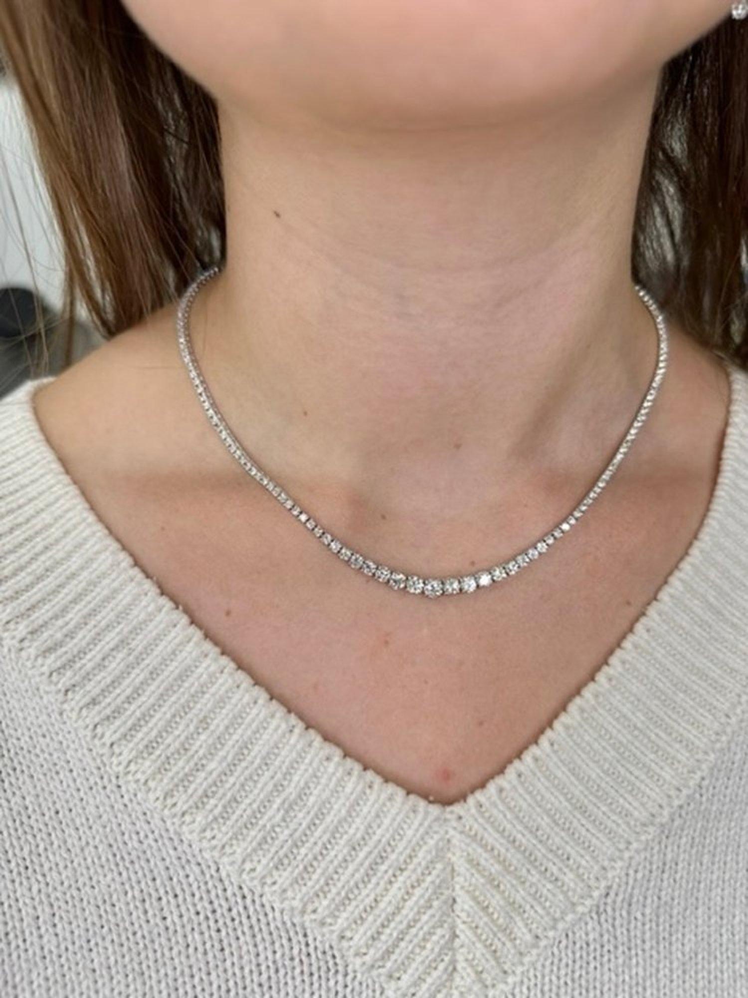 Treat yourself to the most impressive piece of jewelry with Gem Jewelers Co.'s 6.2 Carat Graduated Diamond Tennis Necklace in 14K White Gold.

Expertly crafted by skilled jewelers, this luxurious piece is a true masterpiece of fine jewelry. The