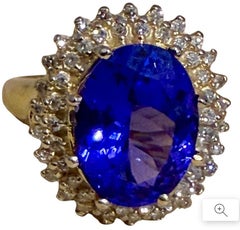 Anello con tanzanite ovale naturale da 6,2 carati e diamante da 1 carato in oro giallo 14k