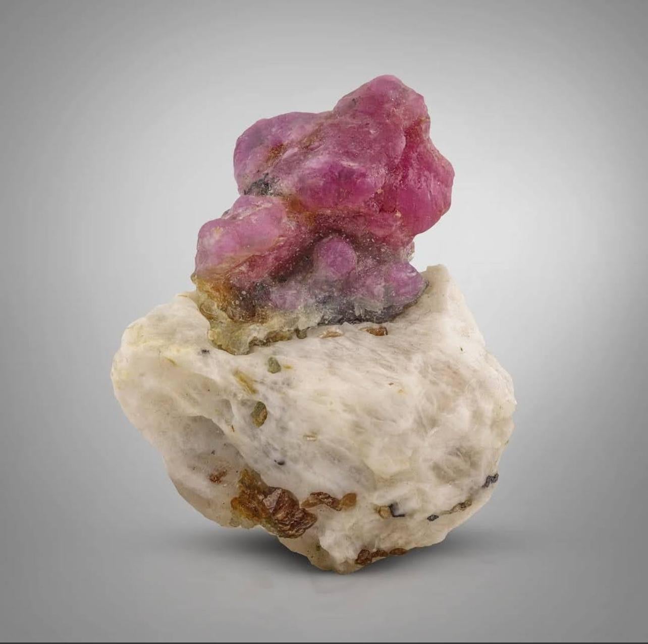 Product Information:

Specimen Type: Ruby Crystals on Marble matrix

Weight: 62 grams

Dimensions: H: 5.8 x W: 5 x D: 1.8 cm

Origin: Jagdalak Mine, Surobi District, Kabul Province, Afghanistan

Treatment: None

Description: 

This specimen features