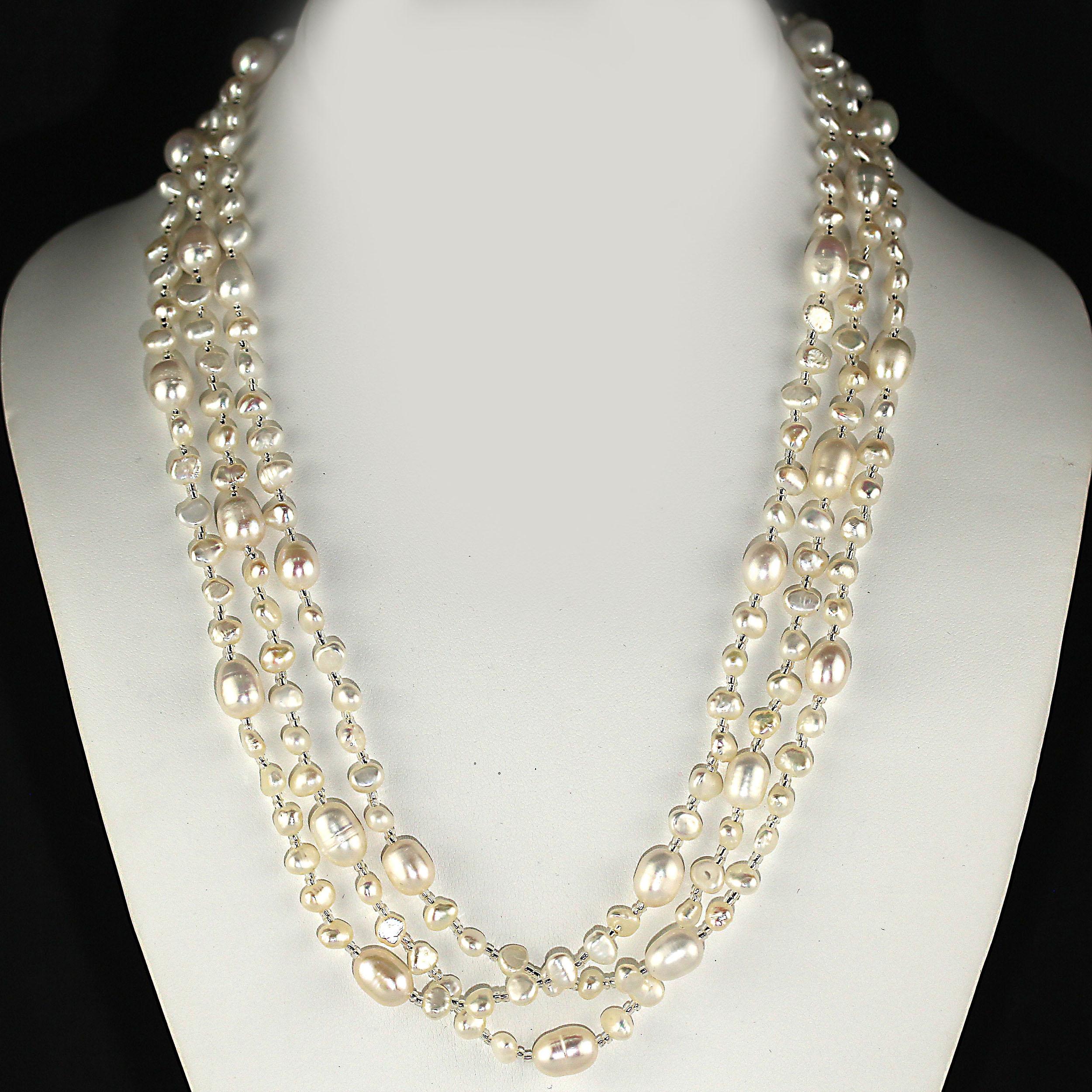 Delightful, sparkling white Freshwater Pearl necklace with silver accents necklace.  This unique necklace is one of those terrific additions to your wardrobe that you will find yourself reaching for again and again.  It's so versatile, you can wear