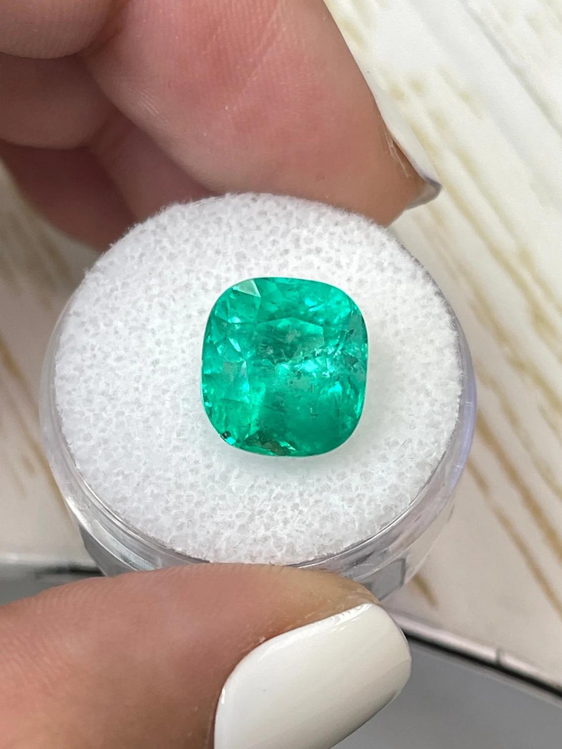 Stone: Emerald
Weight: 6.20-carats
Shape: Cushion Cut
Clarity: Transparent
Luster: Excellent to Very Good
Color: Yellowish Green
Measurements: 11.56mm x 10.79mm x 8.76
Geographic Origin: Colombia
Treatment: Natural, Oiling

Comments: Due to their