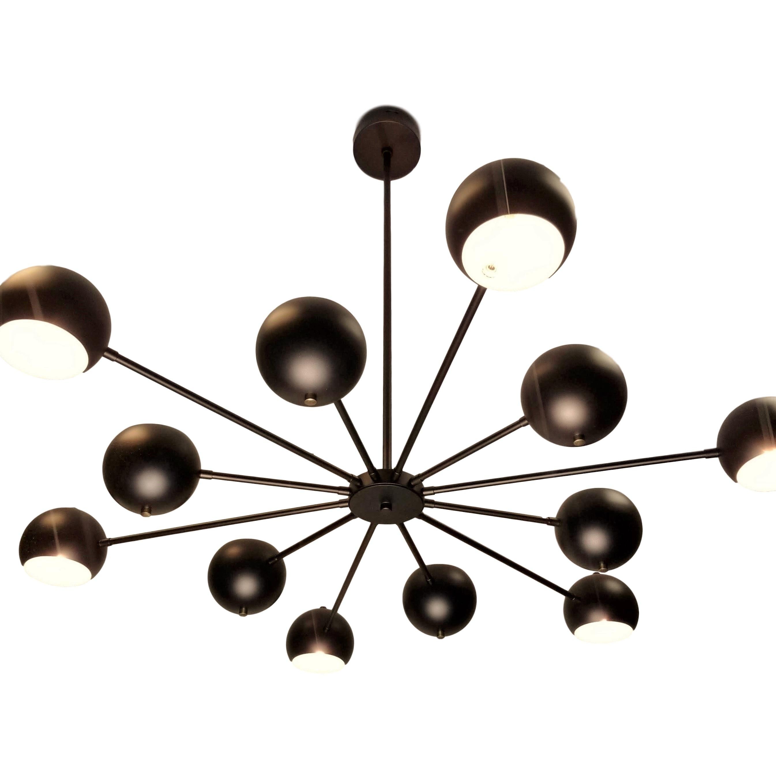 Introducing the Supernova chandelier-- a dynamic, lively design by Blueprint Lighting, 2019. Supernova is constructed with a brass frame with spun aluminium orbs; shown in our hand finished oil-rubbed bronze with natural brass button finials. This