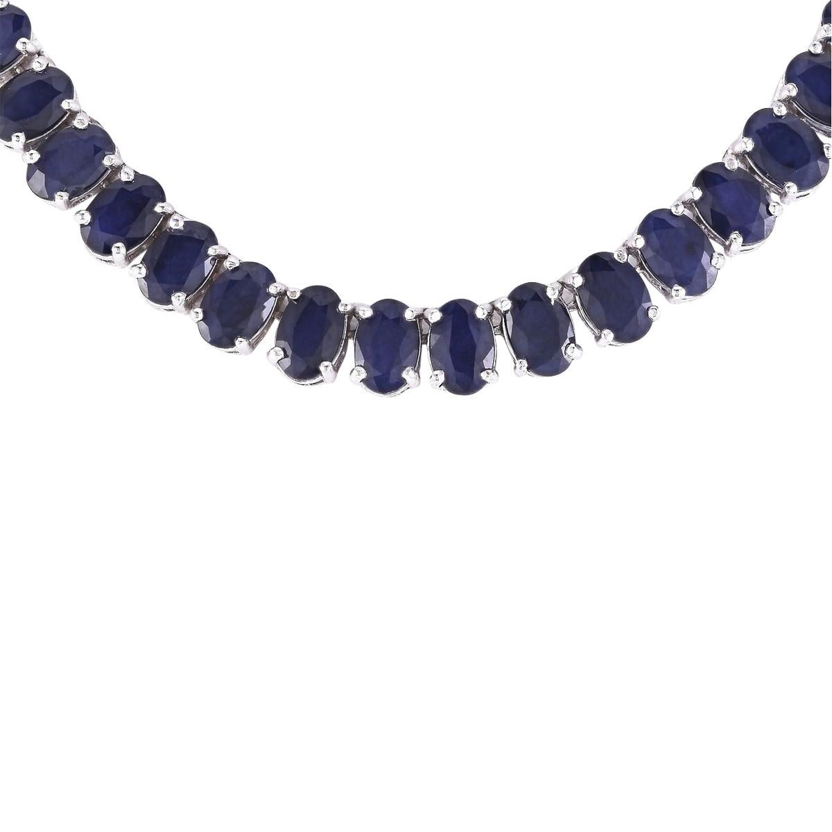 62.00 Carat Sapphire 14 Karat White Gold Necklace
Stamped: 14K White Gold
Total Necklace Weight: 32.0 Grams
Necklace Length: 17 Inches
Necklace Width: 6.00 mm
Gemstone Weight: Total  Sapphire Weight is 62.00 Carat (6.00x4.00 mm)
Color: Blue
Face