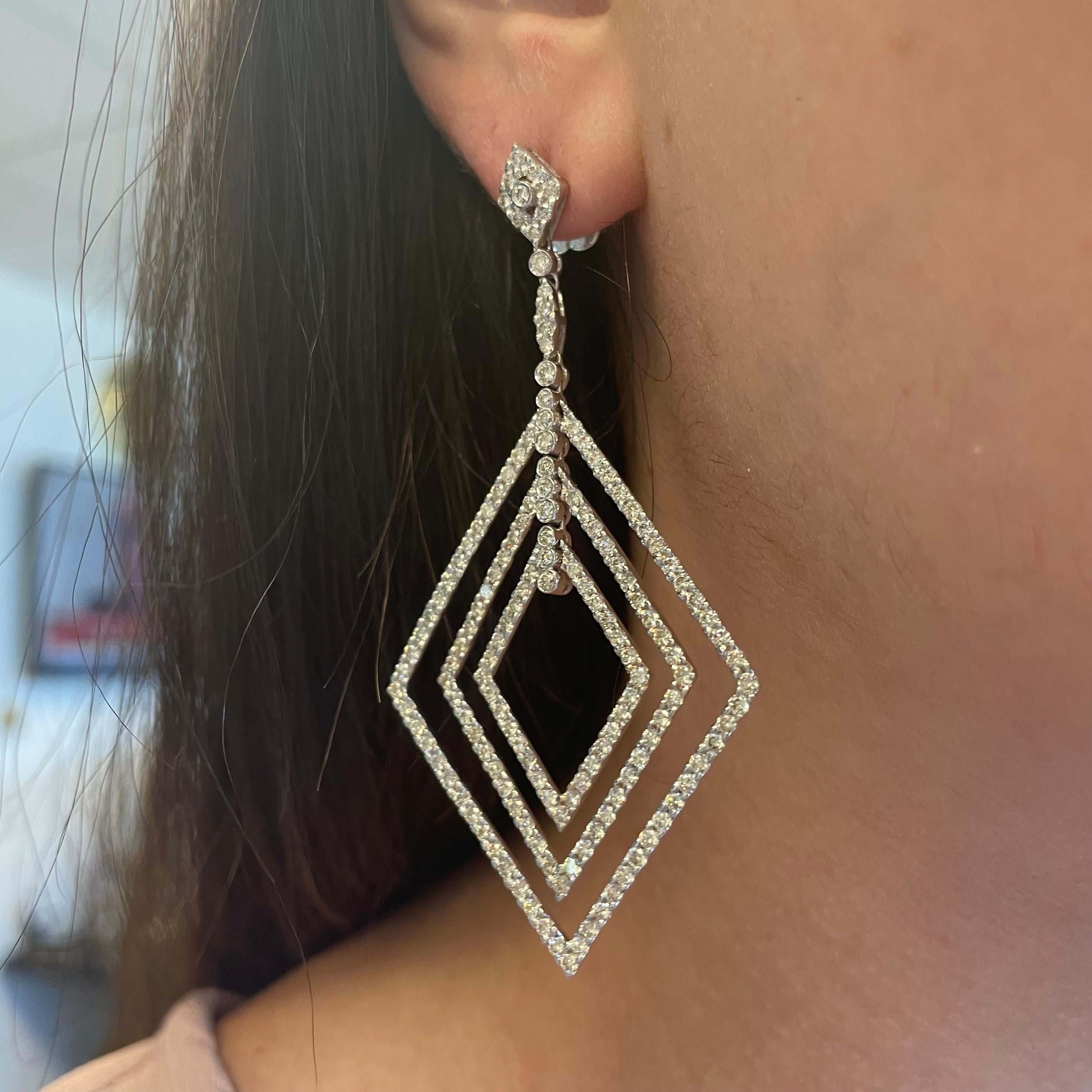 Stunning pave set diamond, diamond shaped chandelier earrings.
310 round brilliant diamonds, 6.20 carats total. Approximately G/H color grade and SI clarity grade. Prong set, 18k white gold.
Accommodated with an up to date appraisal by a GIA G.G.