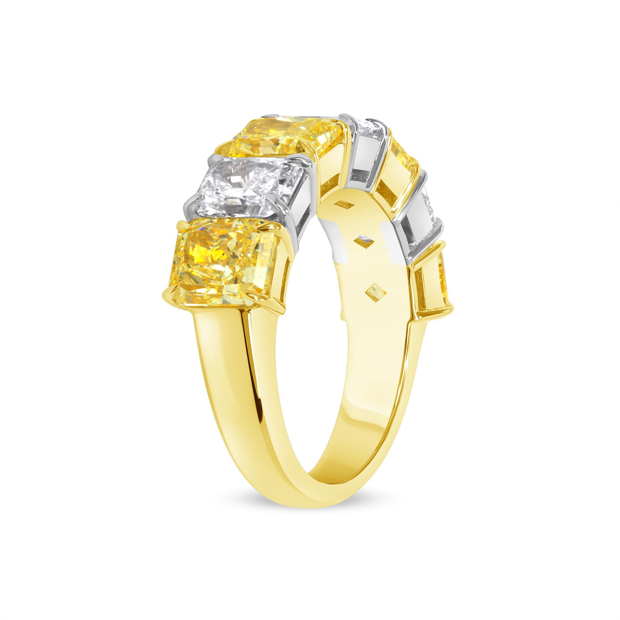 This GIA certified radiant shape diamonds ring has four fancy light yellow diamonds weigh 4.01 carats and three white diamonds weigh 2.19 carats F in color and VS2 in clarity crafted in 18K Yellow Gold and Platinum with a total weight of 6.20