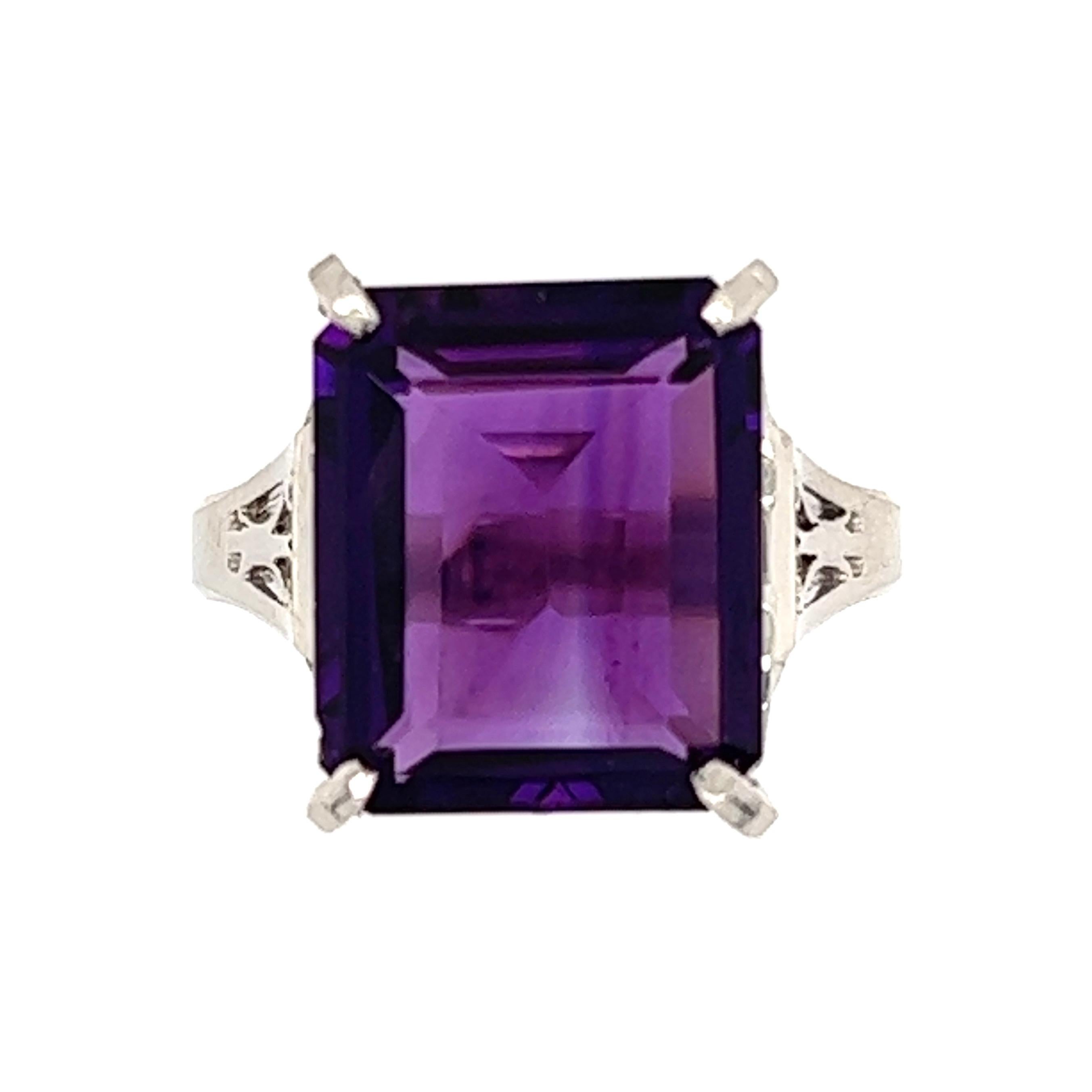  Simply Beautiful! Finely detailed Statement Large Amethyst Cocktail Ring. Centering a 6.21 Carat Emerald-cut Amethyst. Hand crafted Platinum mounting. Approx. Dimensions: 1.06” l x 0.75” w x 0.55” h. Ring size 6.25, we offer ring resizing. C1940s.