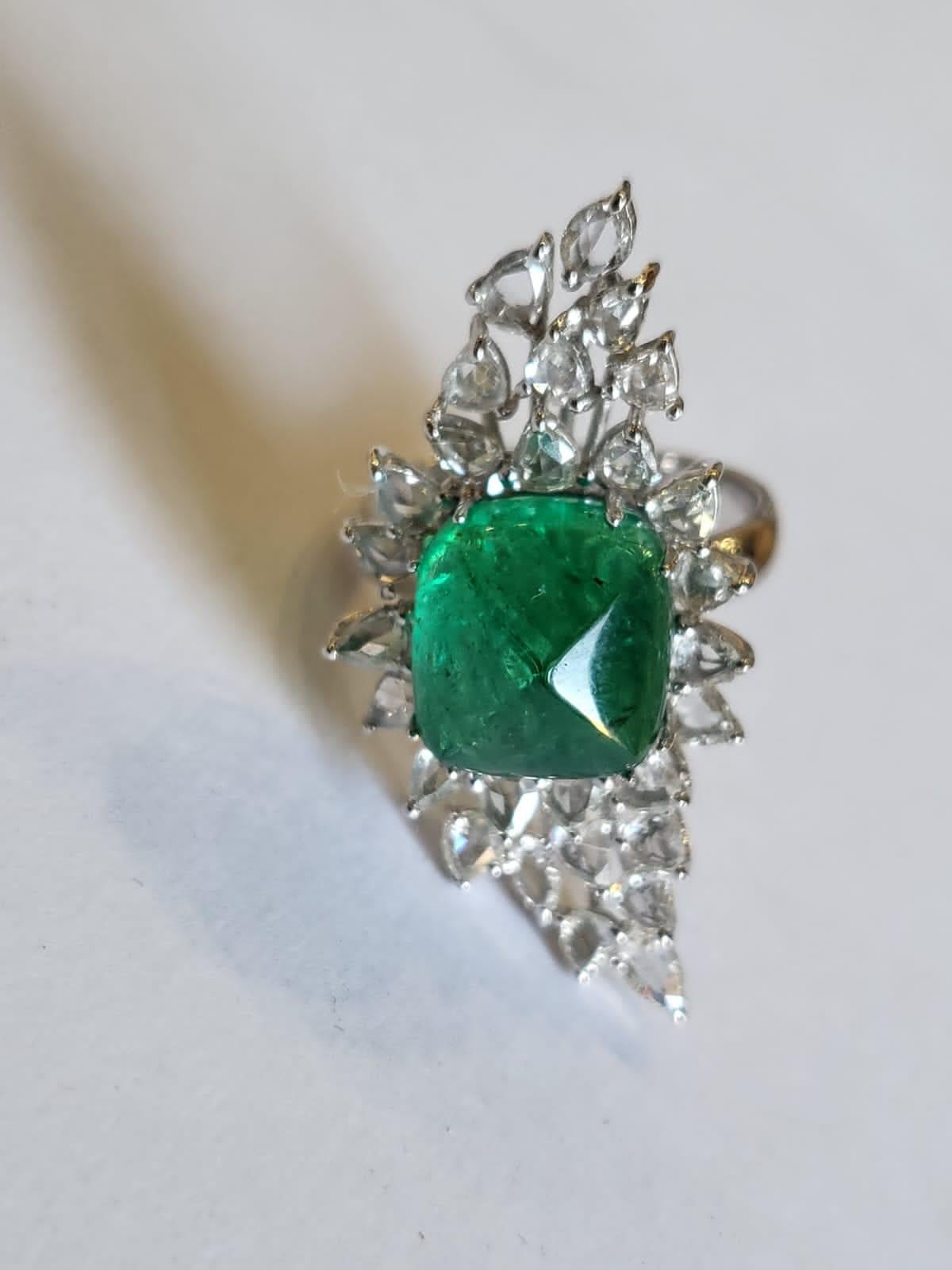A very gorgeous and one of a kind, Emerald Engagement / Dome Ring set in 18K White Gold & Diamonds. The weight of the Emerald sugarloaf 6.21 carats. The Emerald is completely natural, without any treatment & is of Zambian origin. The weight of the