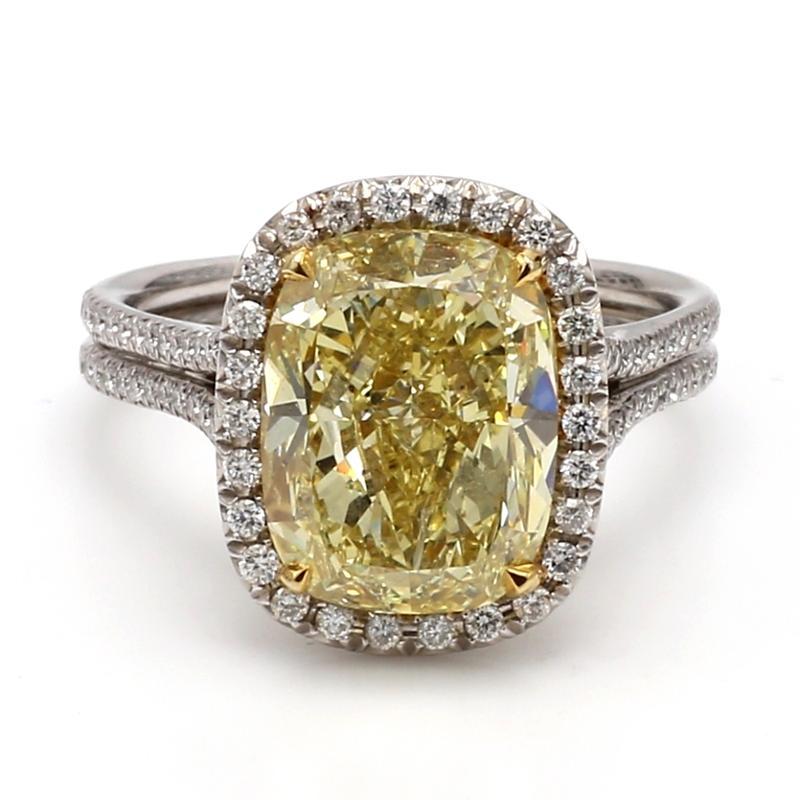 For sale is a platinum and 18K yellow gold GIA certified 6.21ct Fancy Intense Yellow, Cushion Cut diamond, accented with round cut diamonds weighing approx. 1.08 carats. 

CENTER STONE: 6.21ct FIY SI1 Cushion Cut Diamond

ACCENT/SIDE STONES: 173