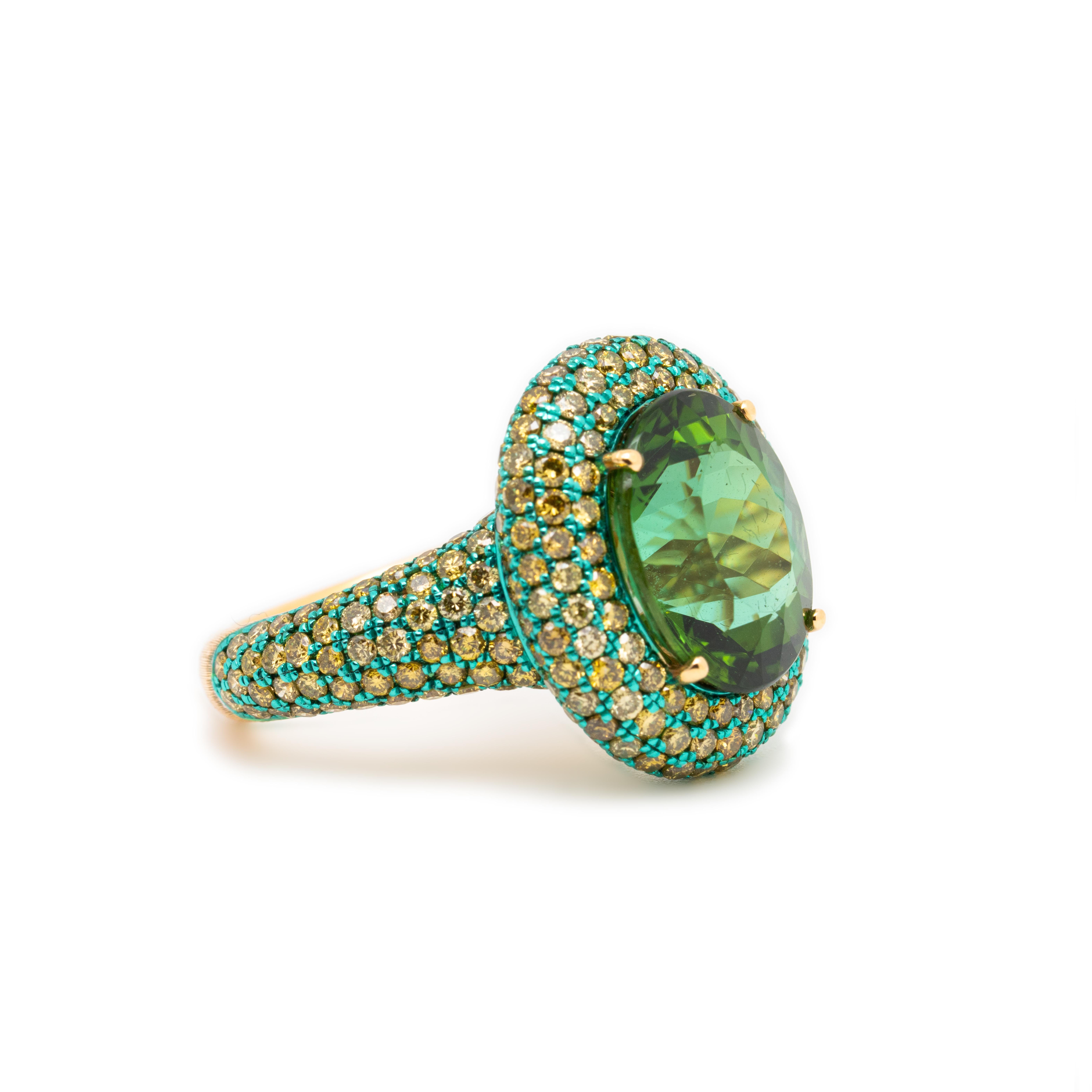 This simple yet stunning design by Austy Lee is crafted for lovers of green. It features a beautiful oval-cut mint green tourmaline, reminiscent of a classic round shape, surrounded by 264 sparkling fancy-colored diamonds. The 18K gold is coated in