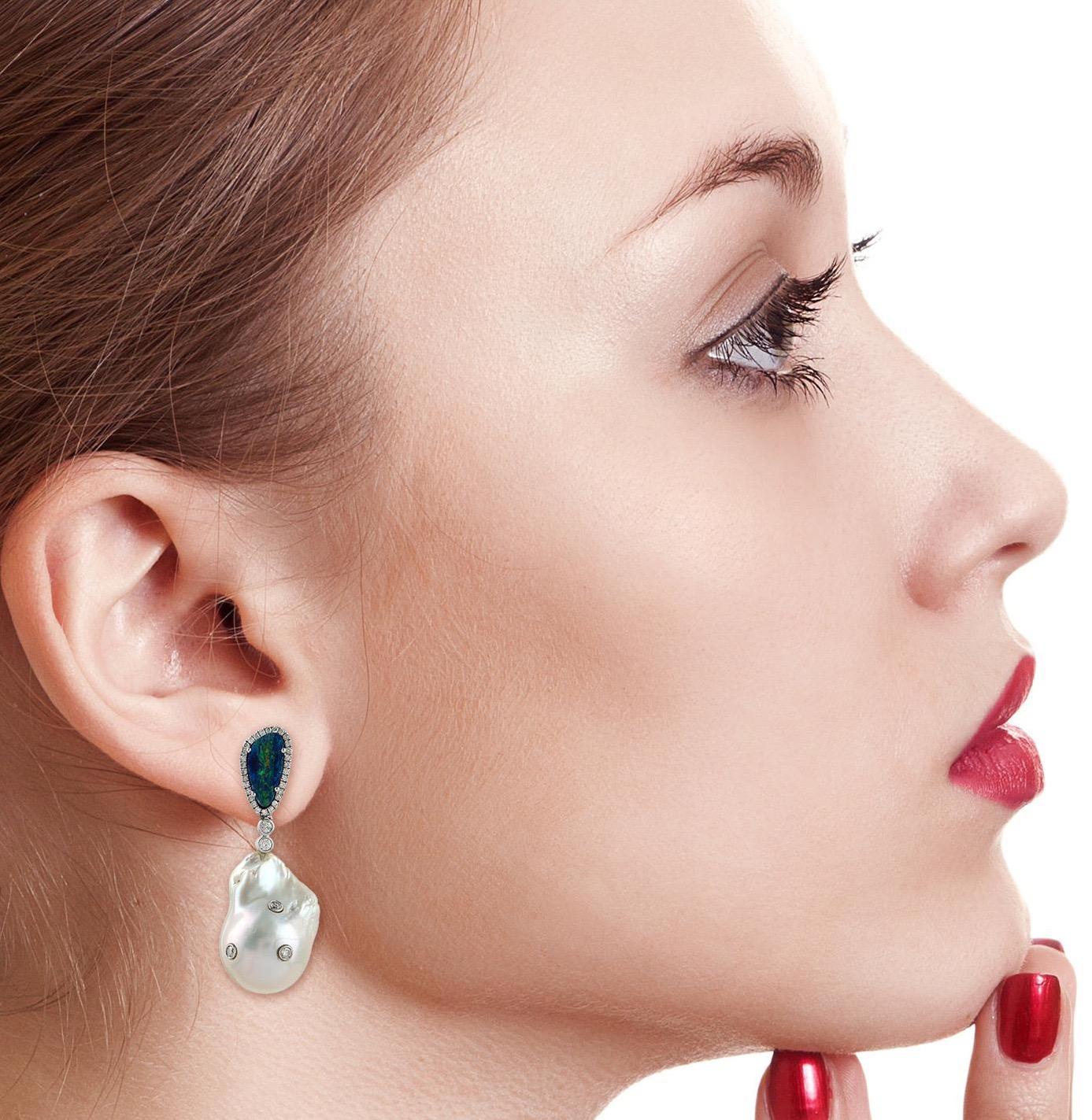 A stunning earrings handmade in 14K gold. It is set in 3.15 carats opal doublet, 62.2 carats pearl and .99 carats diamonds. 

FOLLOW  MEGHNA JEWELS storefront to view the latest collection & exclusive pieces.  Meghna Jewels is proudly rated as a Top