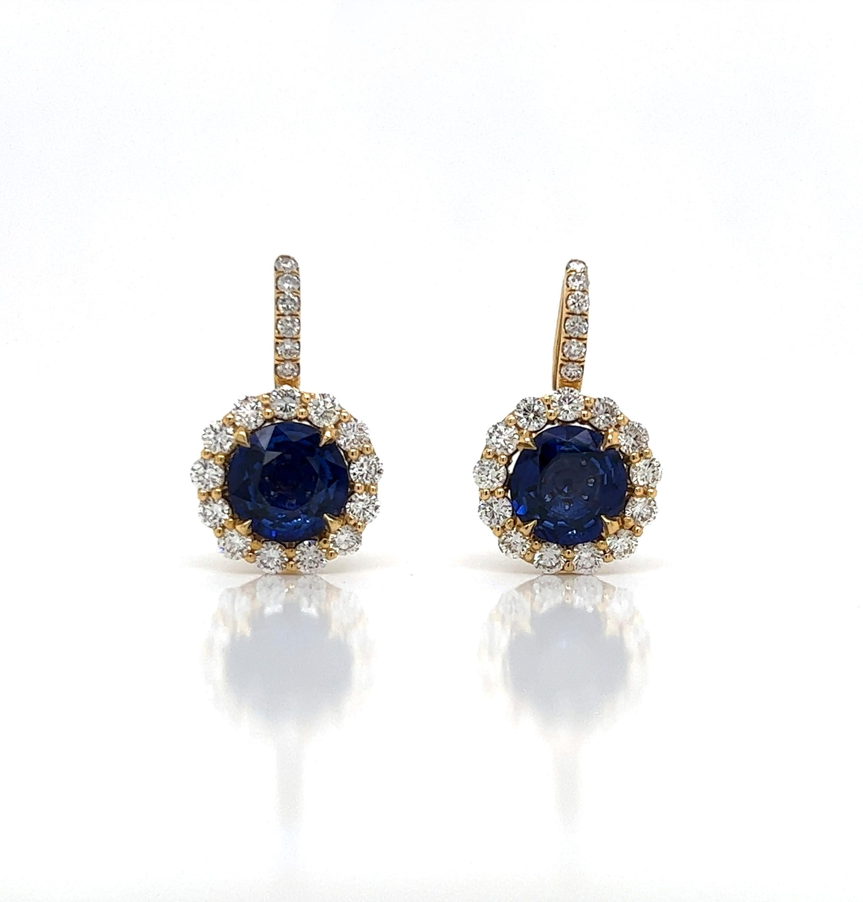 6.23 Total Carat Blue Sapphire and Diamond Halo Pave Earrings in 18K Gold

These glamorous sapphire earrings are perfectly handcrafted from the finest diamonds, sapphire, and quality gold. The aesthetics of blue sapphires surrounded by halo and pave