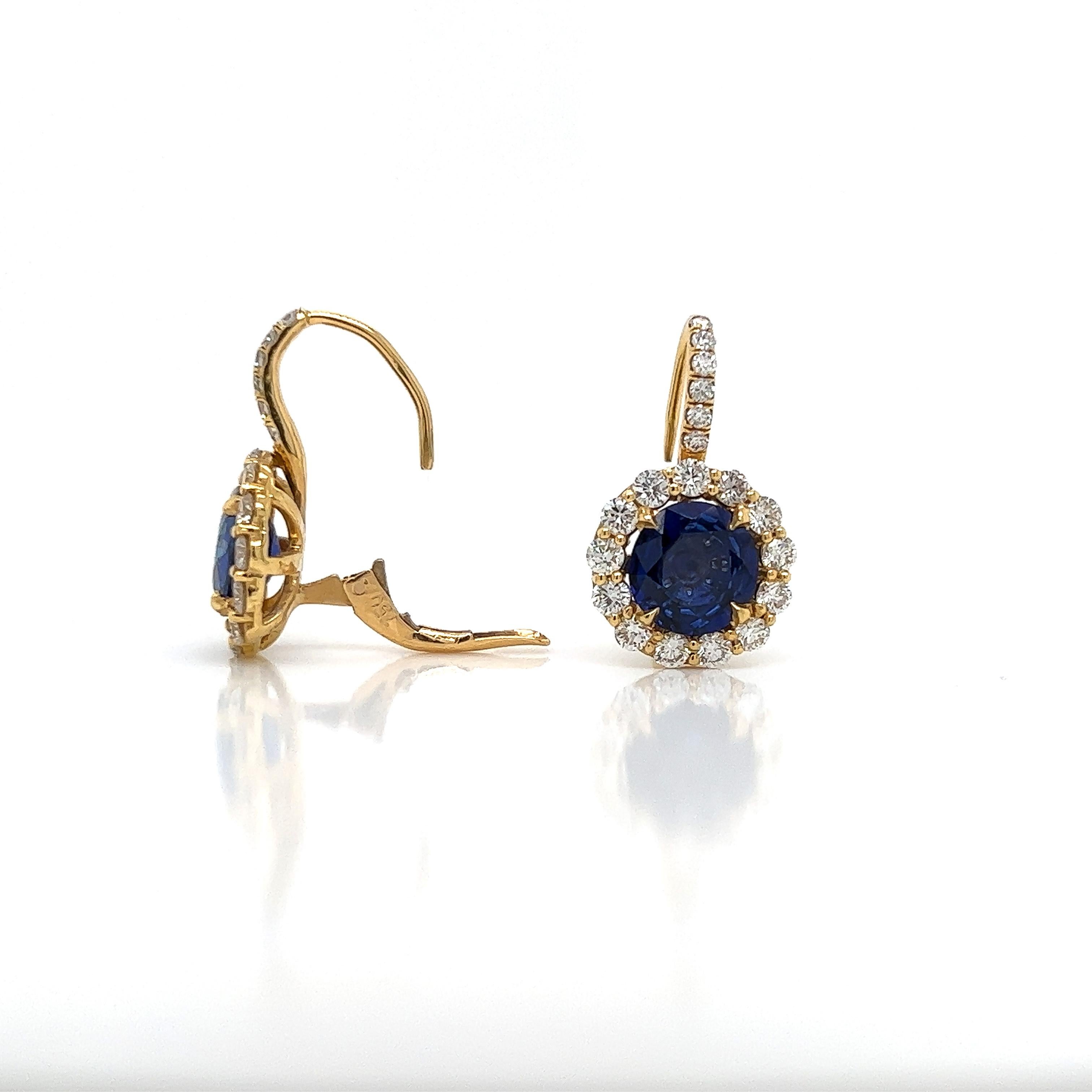 Round Cut 6.23 Total Carat Blue Sapphire and Diamond Halo Pave Earrings in 18K Gold For Sale