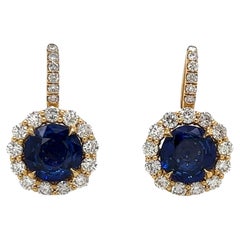 6.23 Total Carat Blue Sapphire and Diamond Halo Pave Earrings in 18K Gold