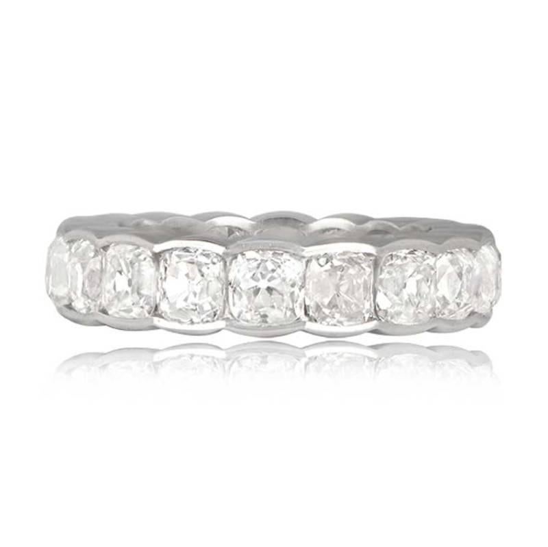An impressive platinum and diamond eternity band showcasing antique cushion-cut diamonds with a total weight of approximately 6.23 carats, G-H color, and VS clarity. The diamonds are individually set in handcrafted platinum bezels, each with an