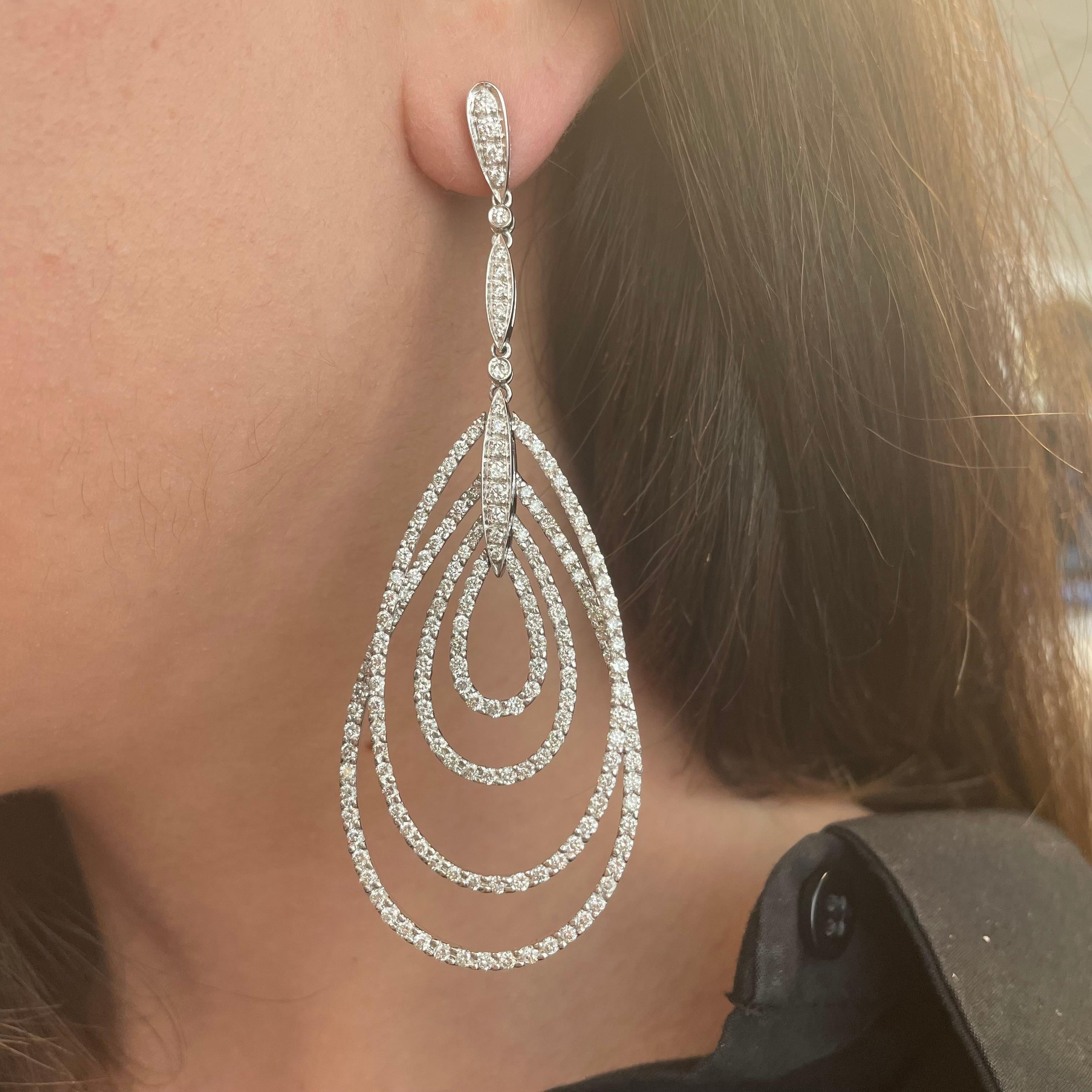 Stunning pave diamond loop/hoop chandelier earrings.
340 round brilliant diamonds, 6.23 carats total. Approximately H/I color grade and SI clarity grade. Prong set, 18k white gold.
Accommodated with an up to date appraisal by a GIA G.G. upon