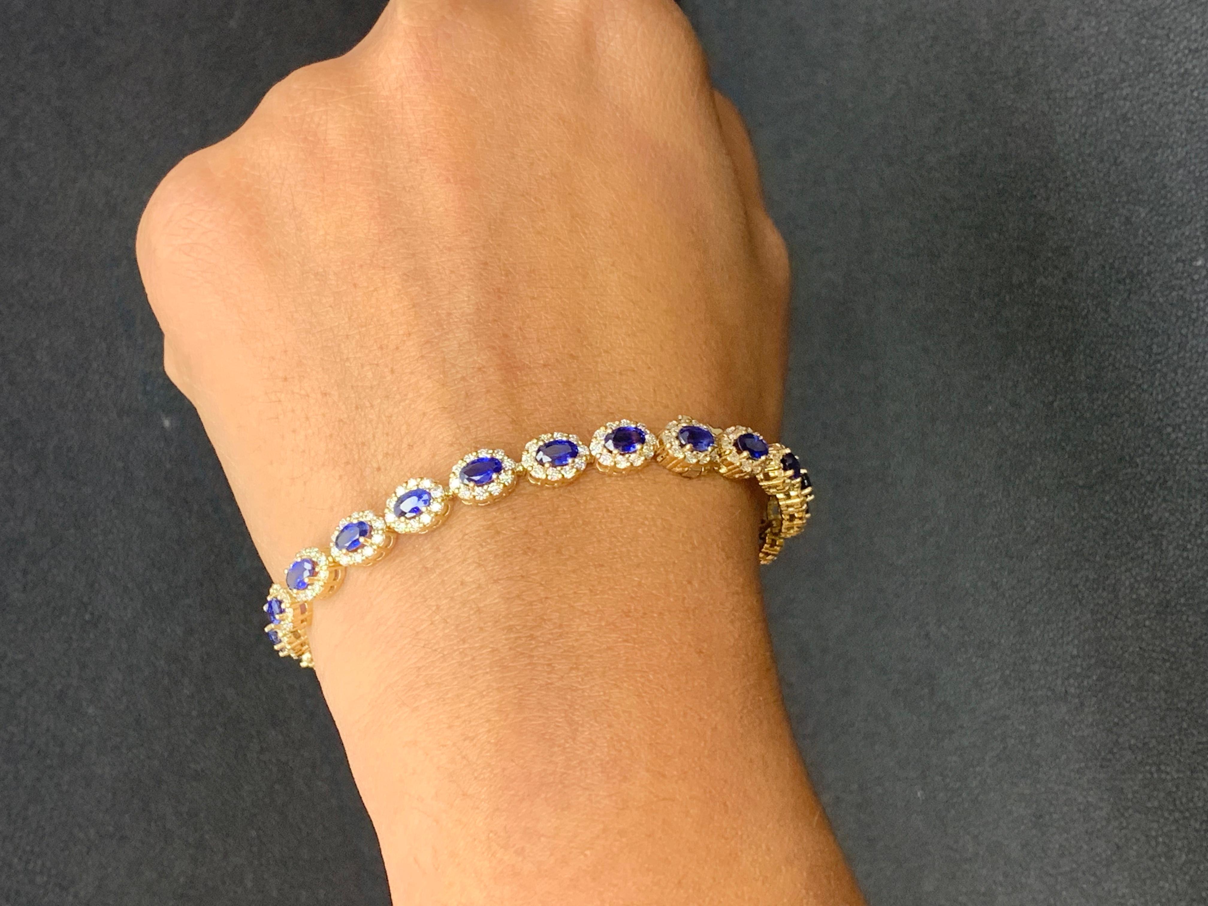 Modern 6.24 Carat Oval Cut Blue Sapphire and Diamond Halo Bracelet in 14K Yellow Gold For Sale