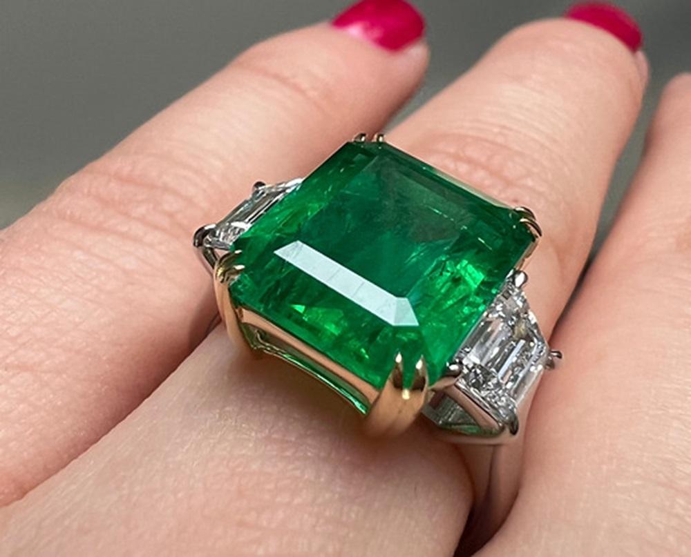 Emerald Weight: 6.25 CTS, Measurements: 12.68 x 10.56 x 6.17 mm, Diamond Weight: 1.06 CTS (E-VS), Metal: Platinum/18K Yellow Gold Basket, Ring Size: 7, Shape: Emerald-Cut, Color: Green, Hardness: 7.5-8, Birthstone: May, CD Certified