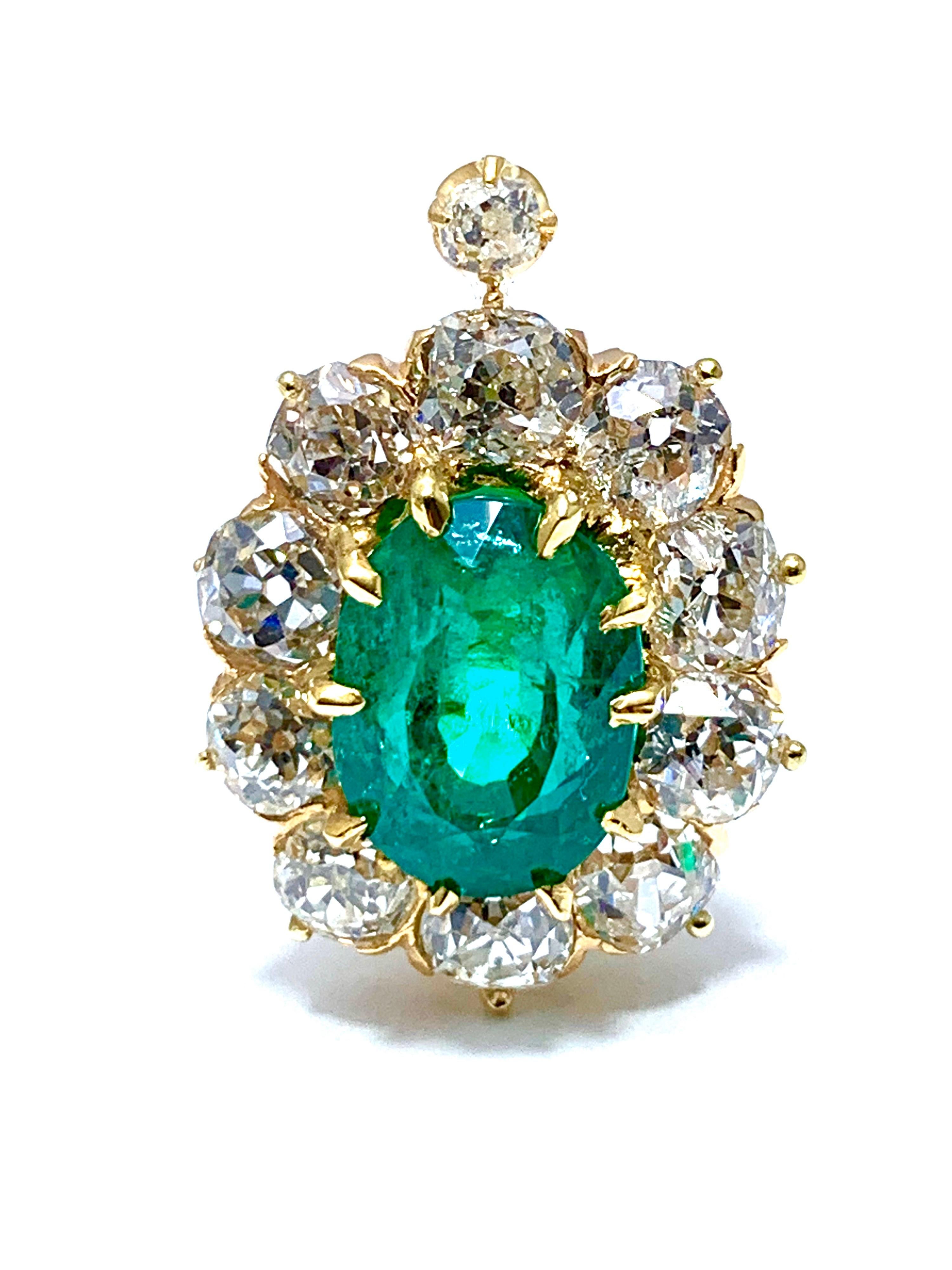 An absolutely stunning pair of natural Colombian emerald and old European cut diamond clip earrings, set in 18k yellow gold. The emeralds have a combined weight of 6.25cts, and an AGL report stating that they are natural, Colombian origin, with