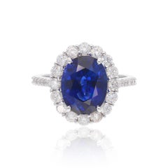 6.25 Carat Oval Blue Sapphire Ring 1.05 Carat SI/H Diamond 18 Karat White Gold 6.25 Carat Oval Blue Sapphire Ring 1.05 Carat SI/H Diamond 18 Karat White Gold