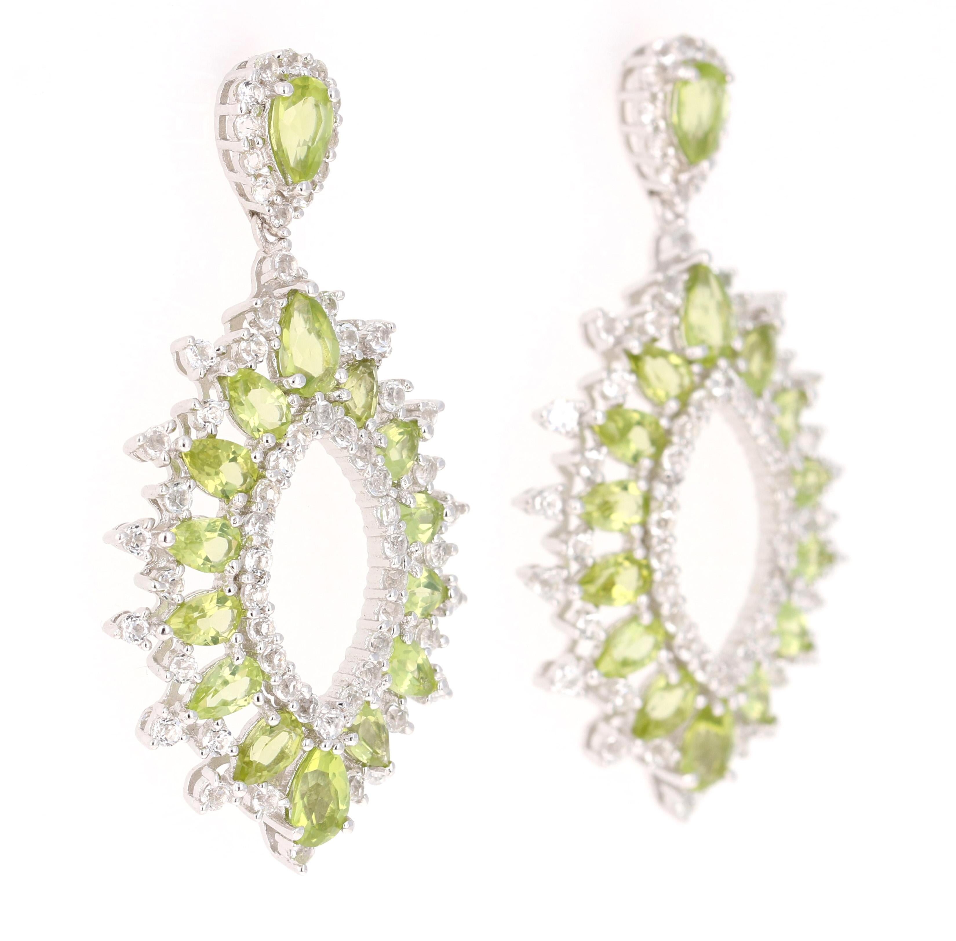 Stunning Dangle Earrings 

These earrings have 6.25 Carats of Peridot and White Topaz

They are beautifully curated in 925 Silver 

They are 1.75 inches long. 

