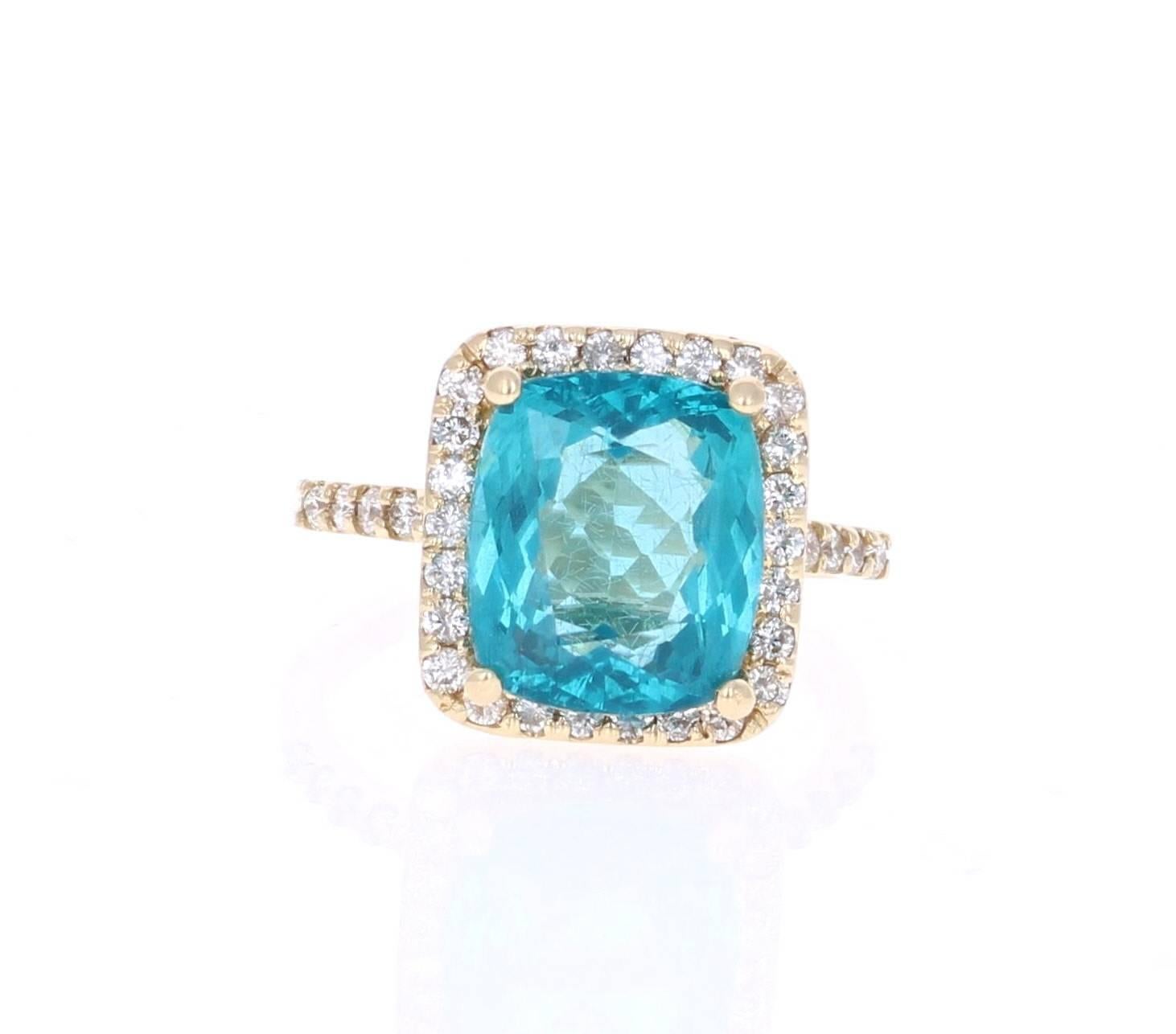 Classic and beautifully designed Apatite and Diamond Ring!  This ring has a 5.64 carat Apatite in the center of the ring and is surrounded by 38 Round Cut Diamonds that weigh a total of 0.62 carats. The total carat weight of the ring is 6.26 carats.