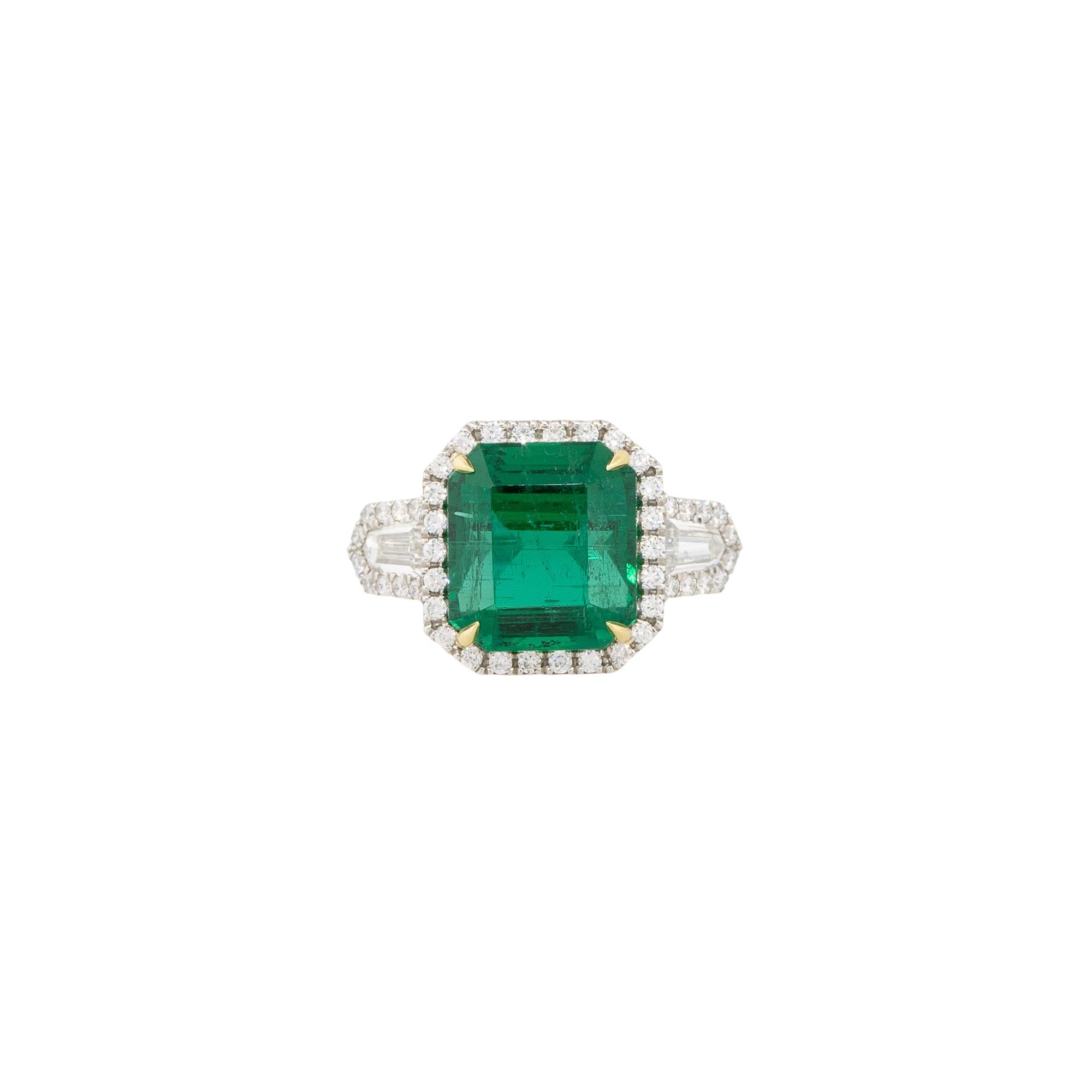 Platinum and 18k Yellow Gold 6.26ctw Emerald and Diamond Halo Ring

Style: Women's Emerald and Diamond Ring
Material: Platinum and 18k Yellow Gold
Gemstone/Diamond Details: Approximately 6.26ctw of Emerald cut Emeralds. Approximately 0.53ctw of